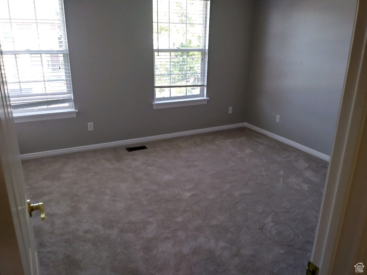 Spare room featuring carpet