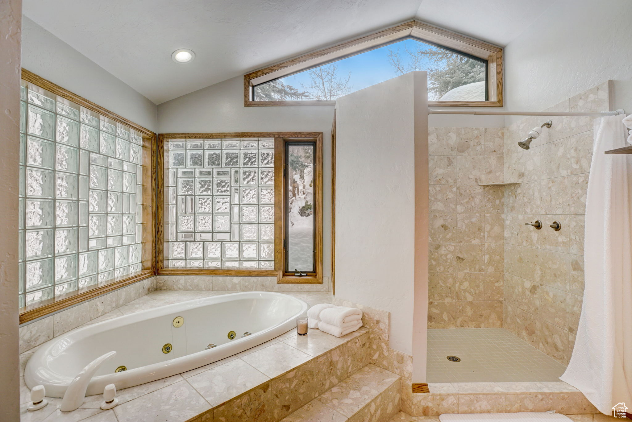 Bathroom with vaulted ceiling and plus walk in shower