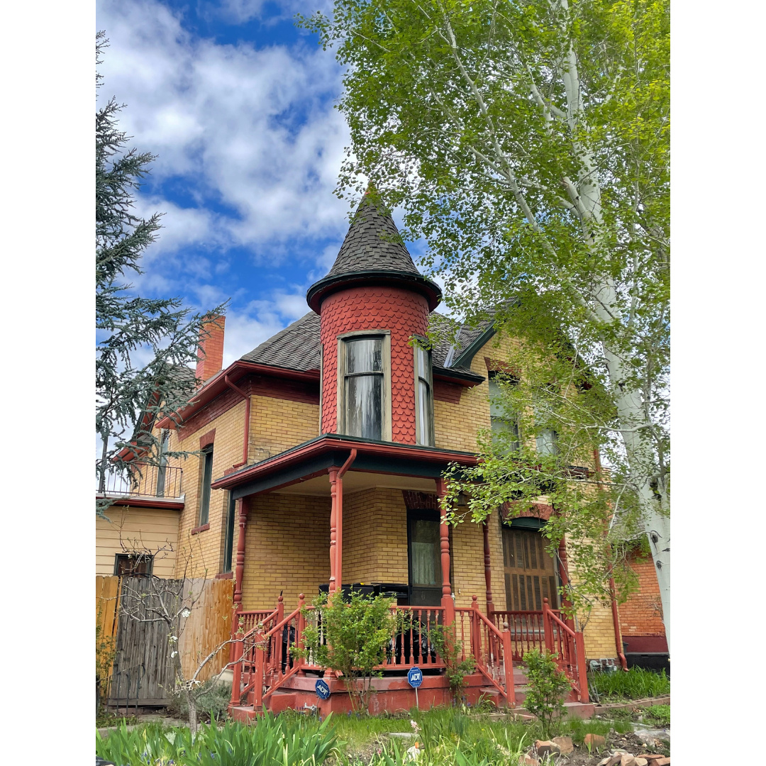 Queen Anne Victorian house with turret room and covered porch