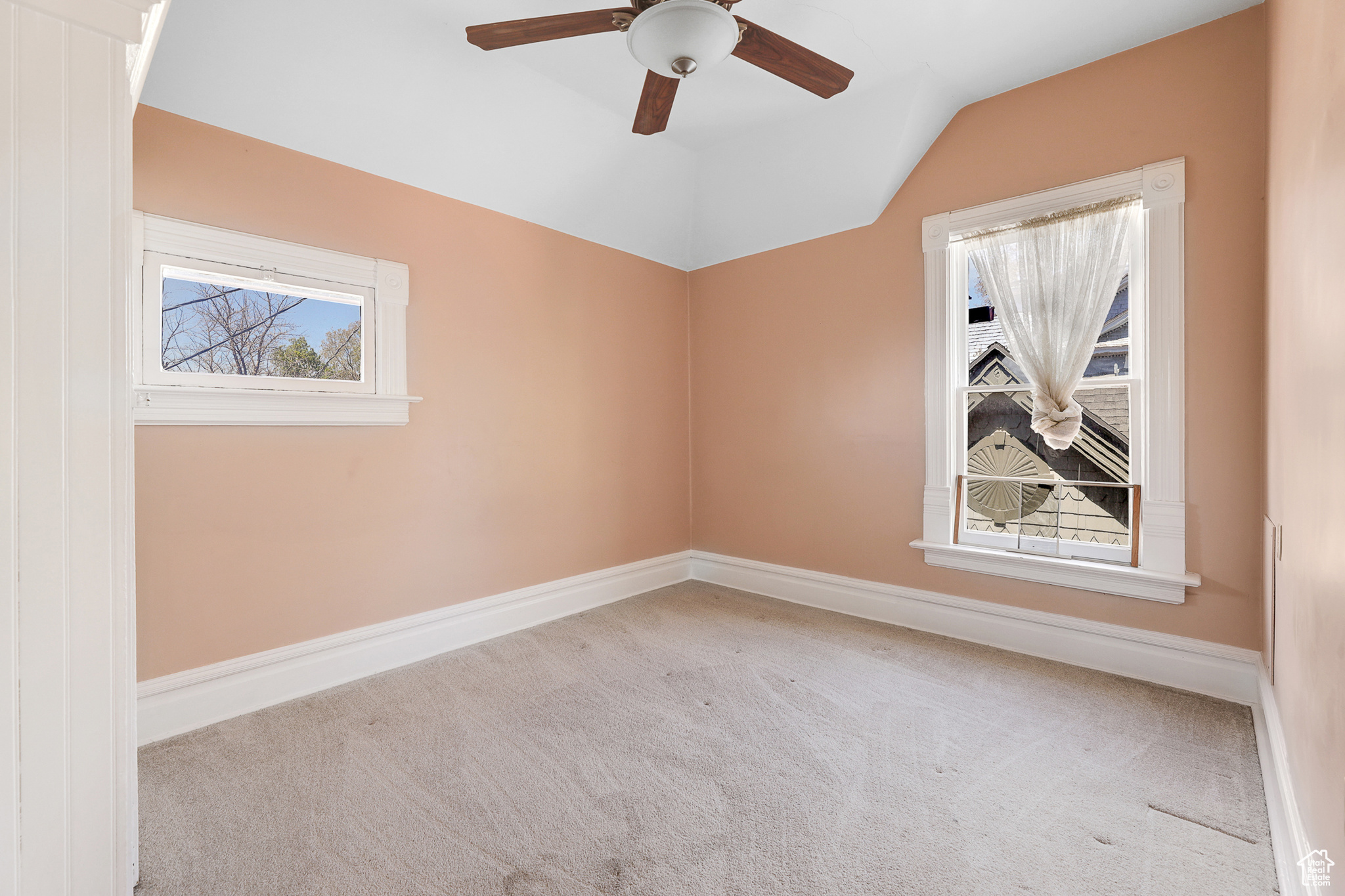 2nd Bedroom Carpeted spare room featuring ceiling fan and lofted ceiling