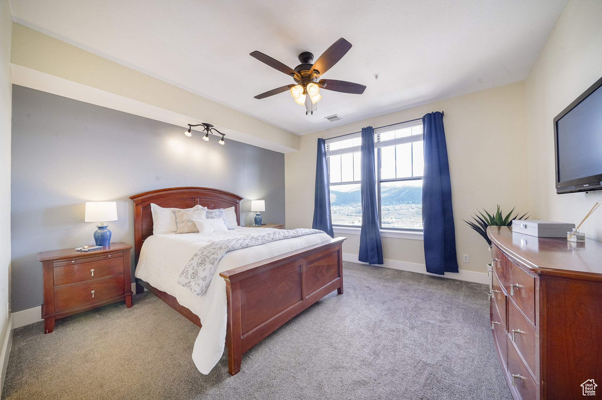 Bedroom with carpet flooring and ceiling fan