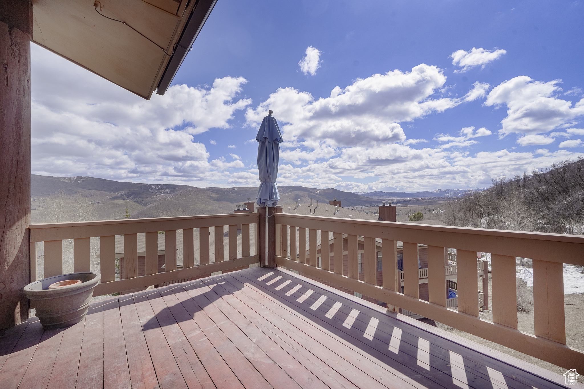 Wooden terrace featuring a mountain view