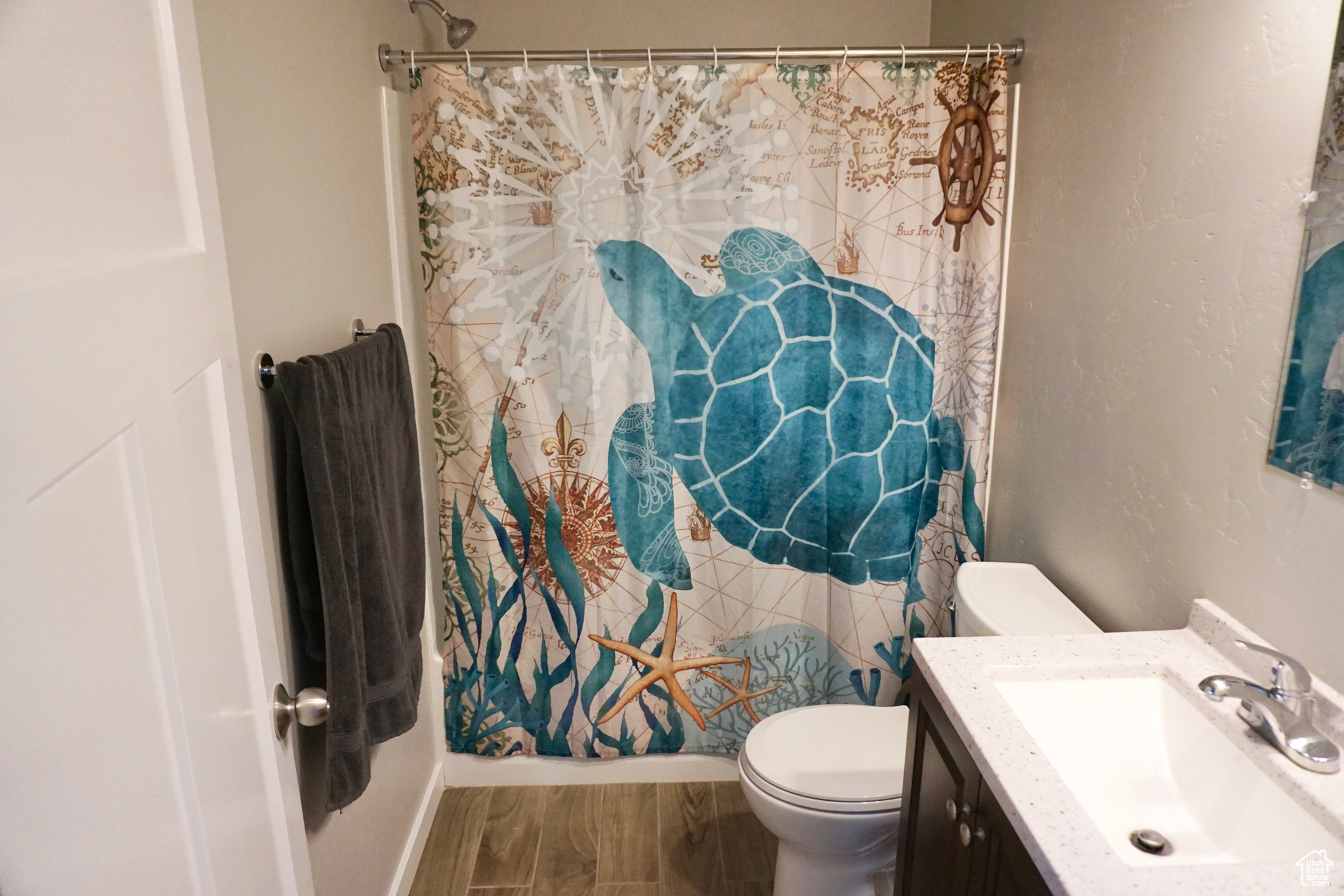 Bathroom featuring tile flooring, vanity, and toilet