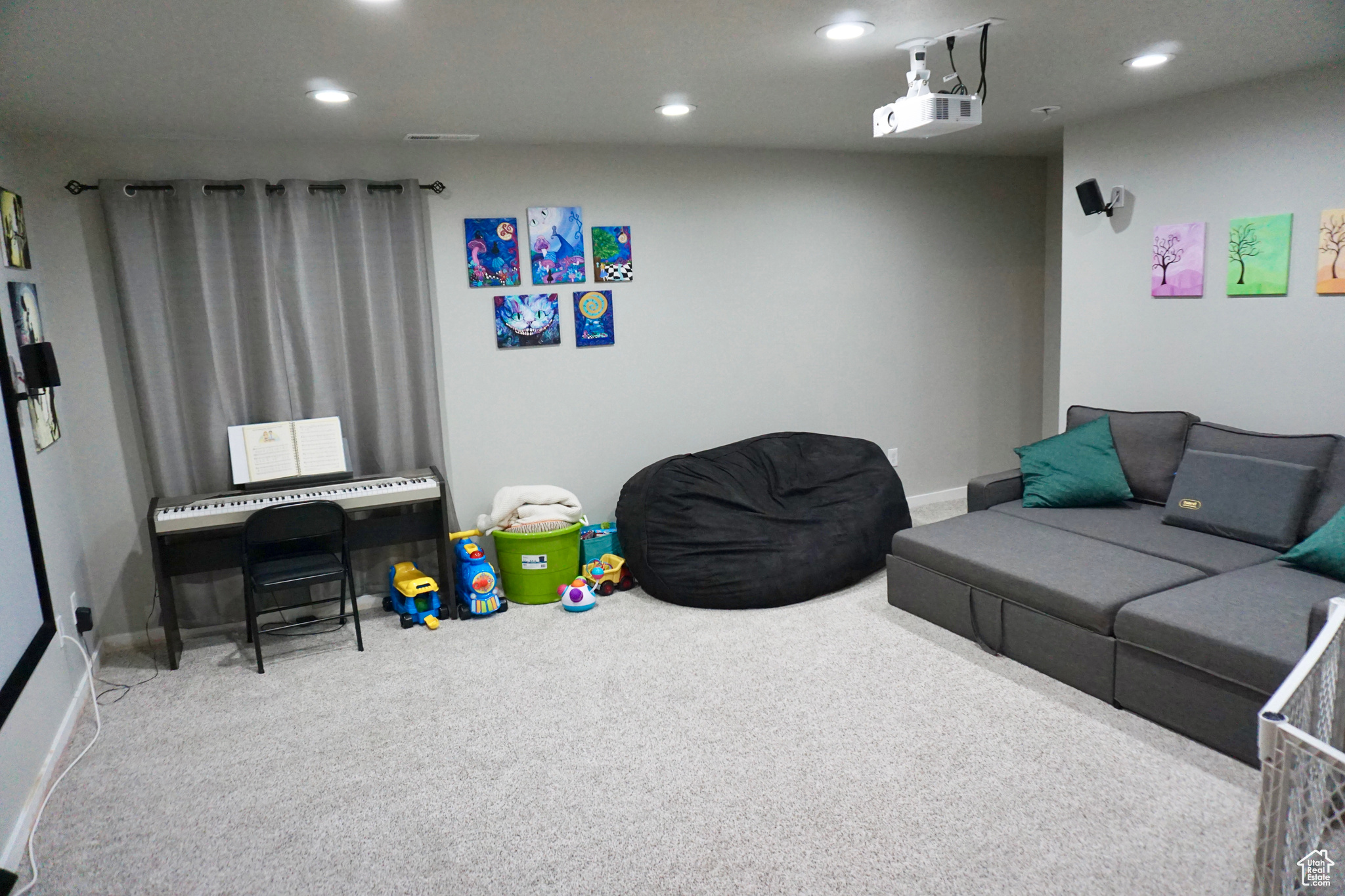 Carpeted basement that can be used as bedroom, living area, or media room
