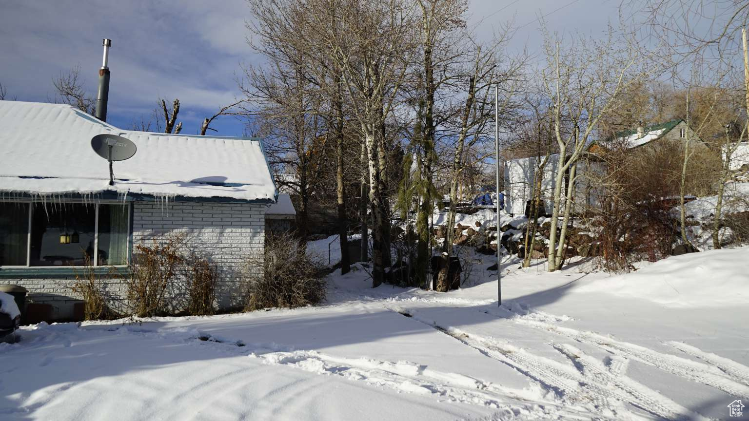 View of snow covered property