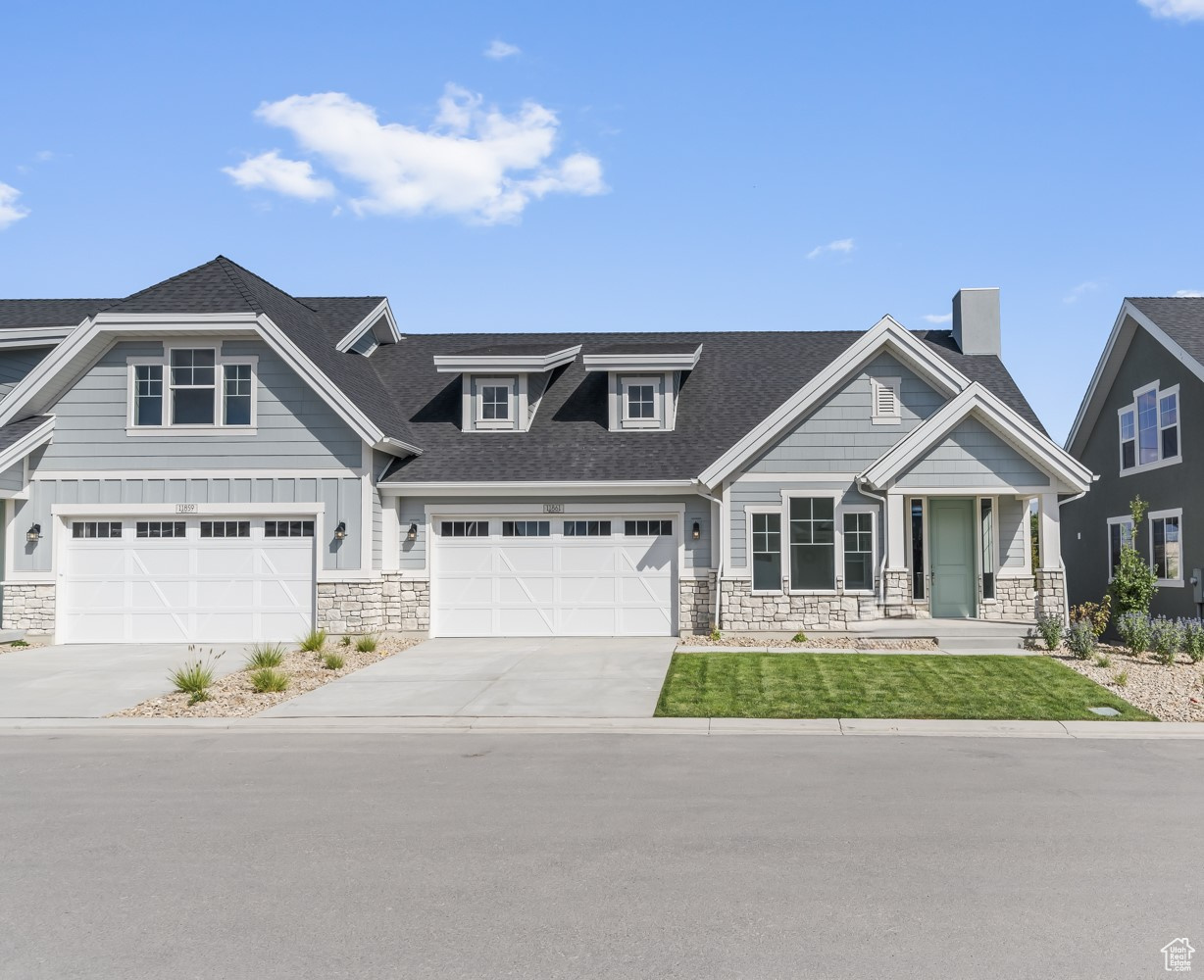 Craftsman-style home featuring a garage