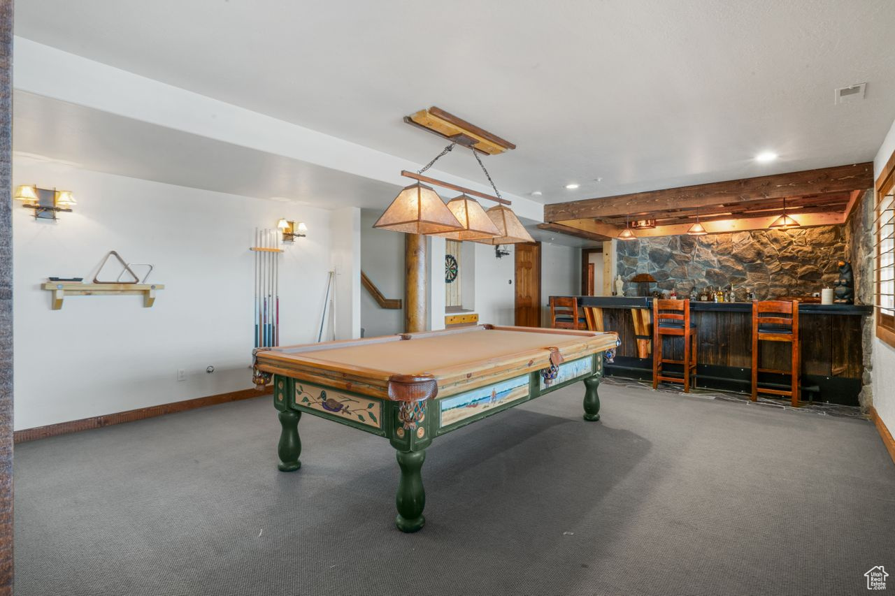 Recreation room featuring pool table and indoor bar