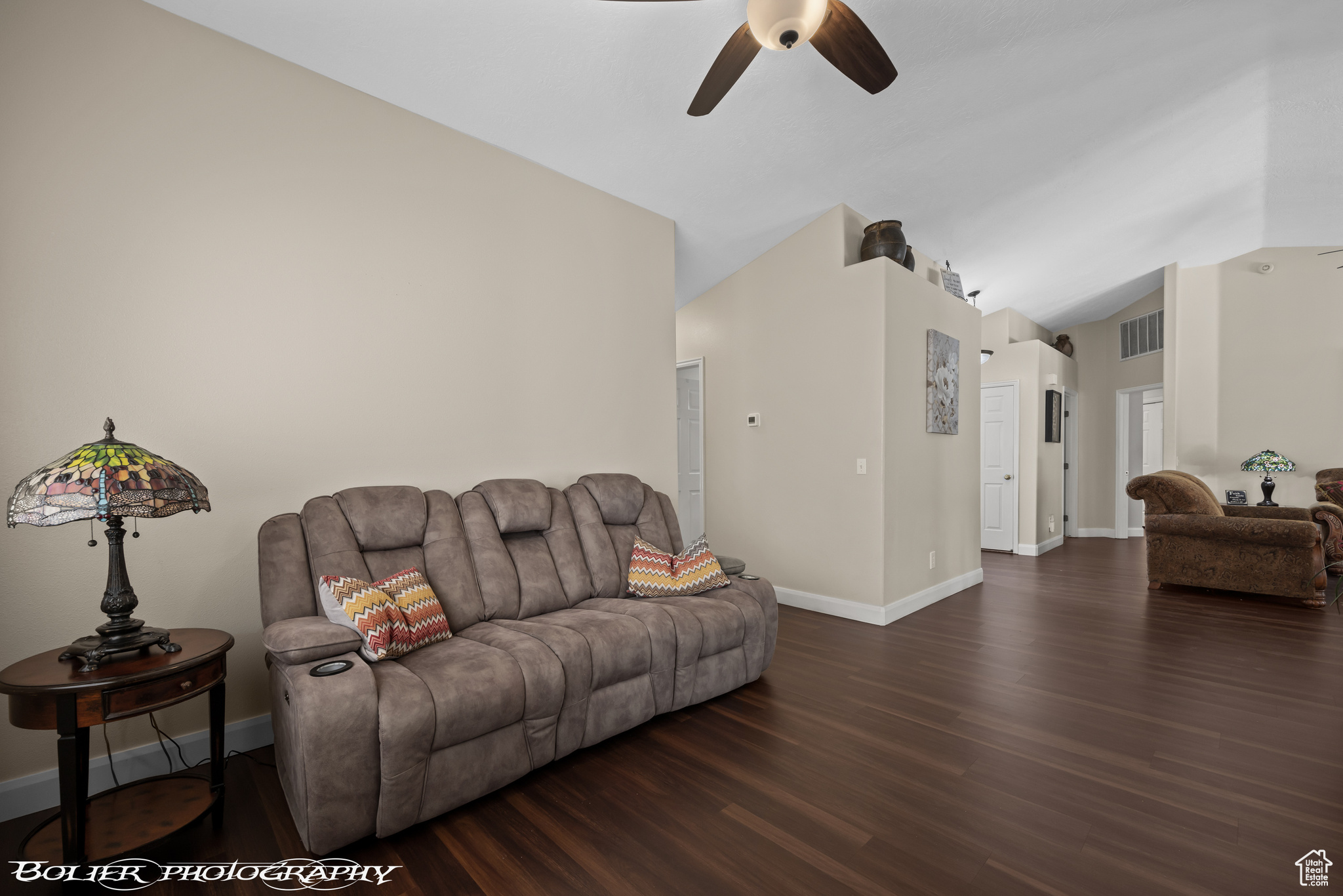 Second Living area with dark hardwood / wood-style flooring, ceiling fan, and lofted ceiling