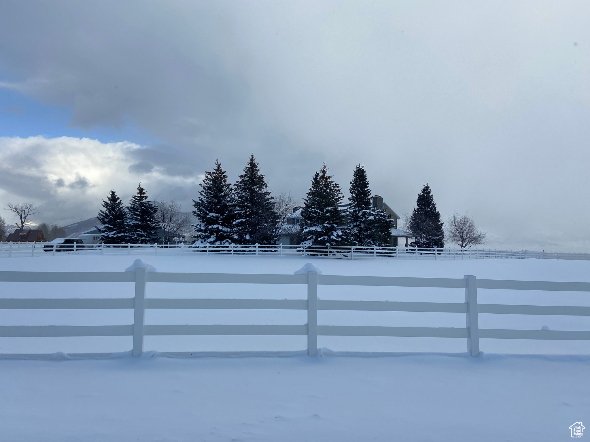 View of snowy front pasture