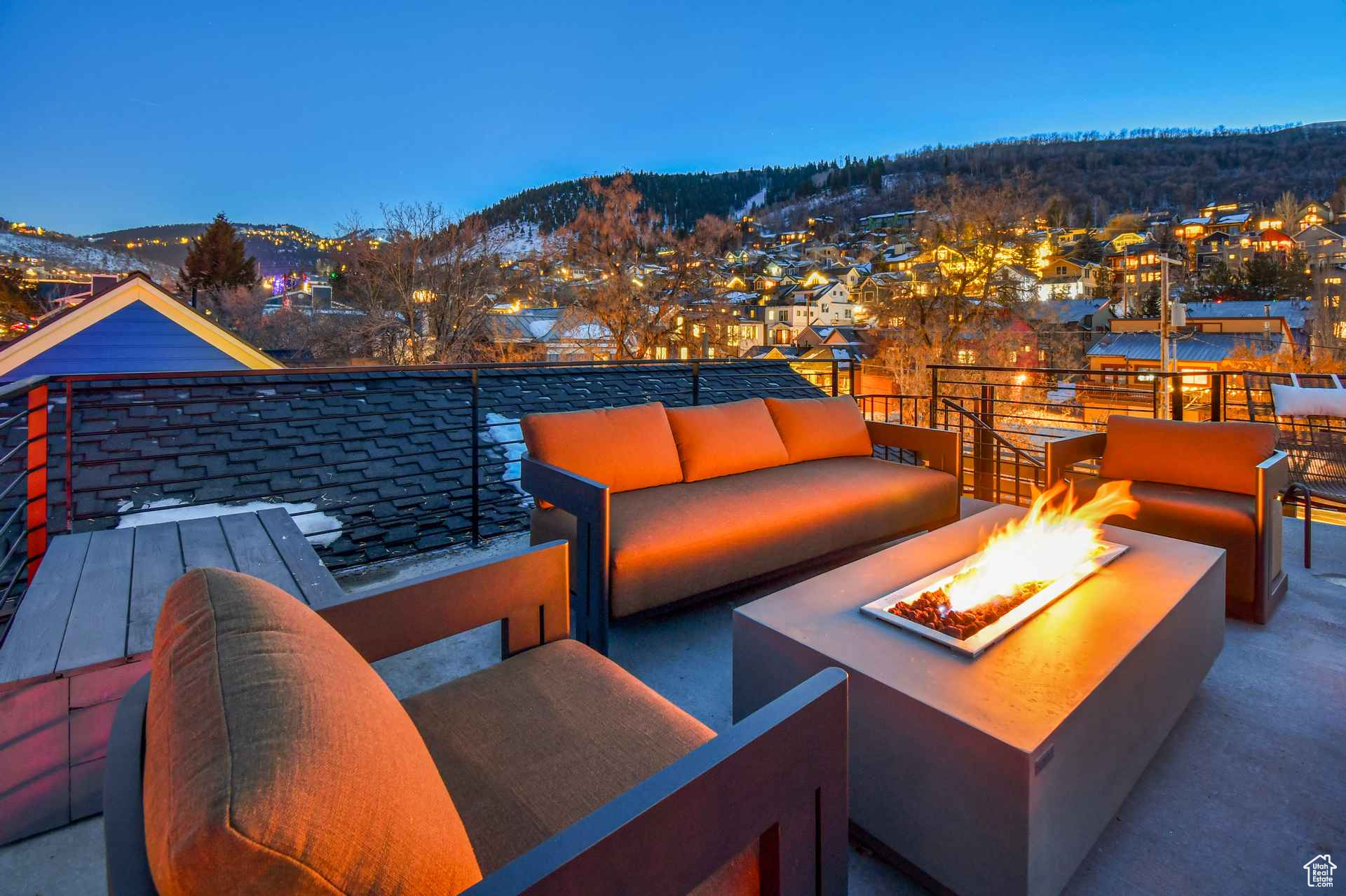 View of patio / terrace with a mountain view and an outdoor living space with a fire pit