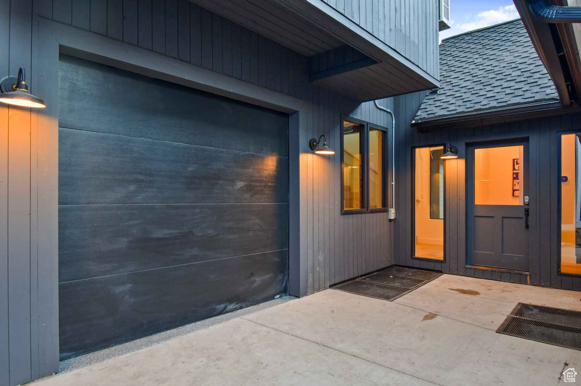 Property entrance featuring a garage