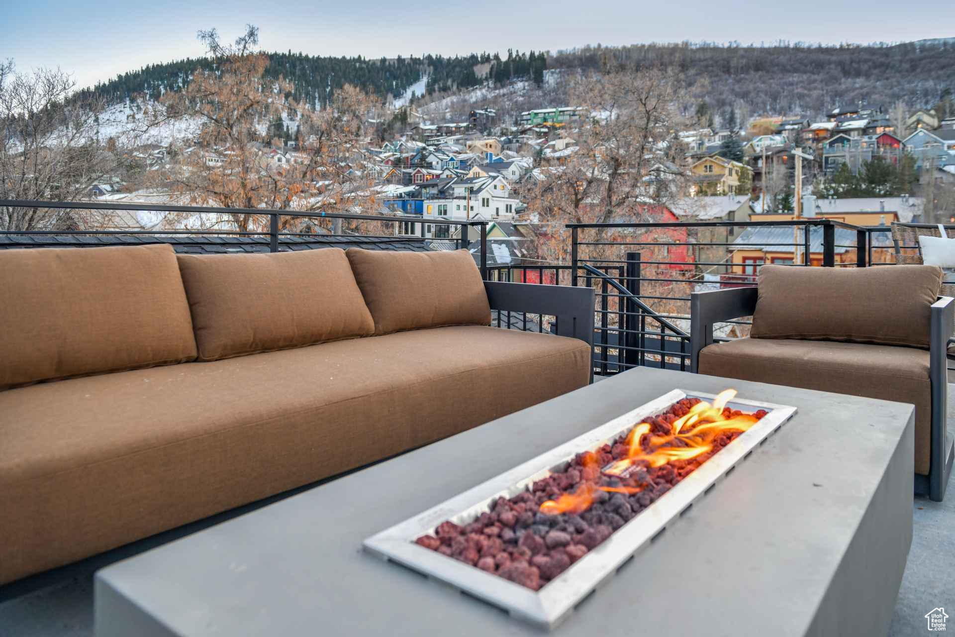 Balcony featuring a mountain view and a fire pit