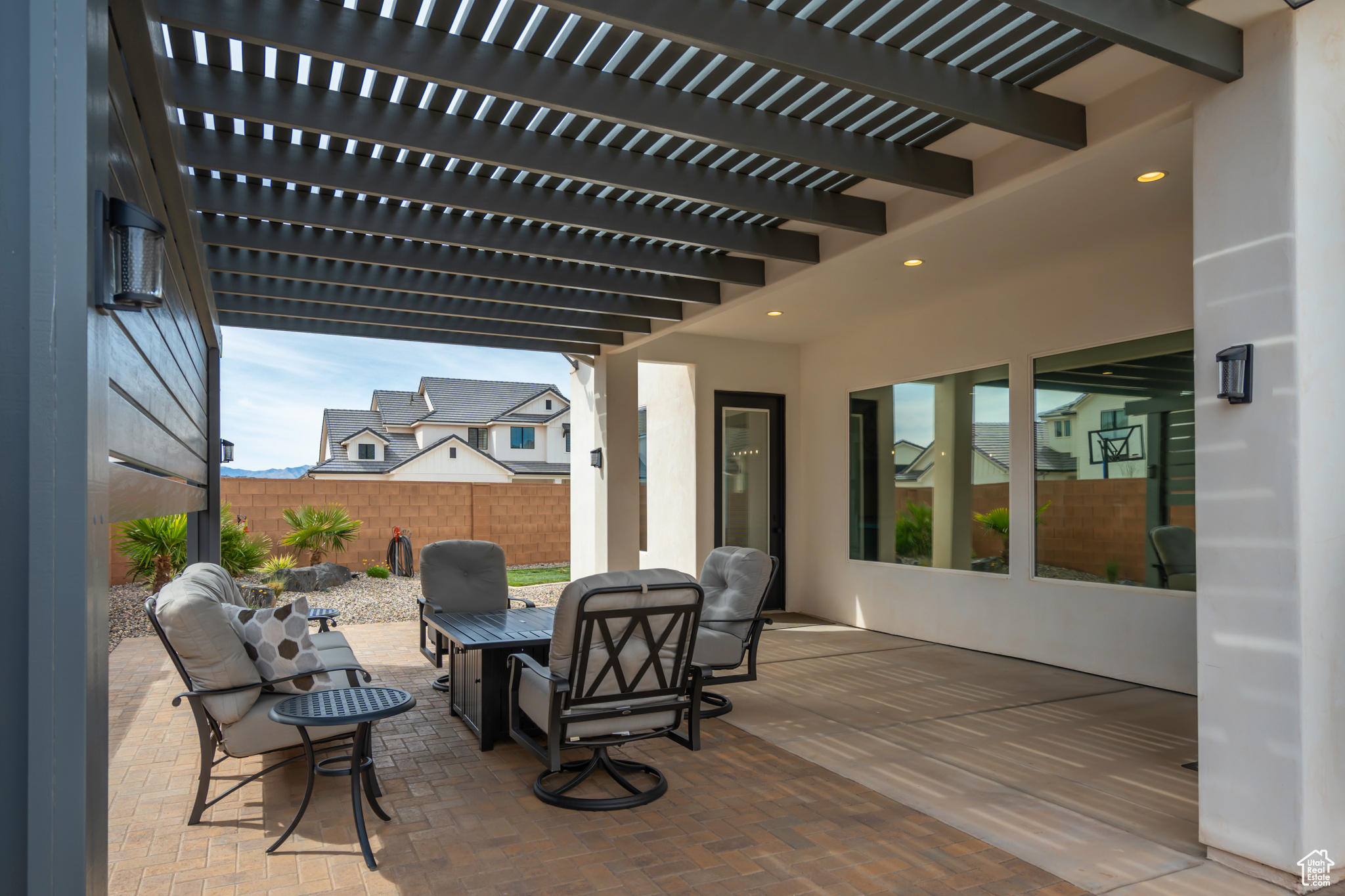 View of terrace with a pergola and an outdoor hangout area