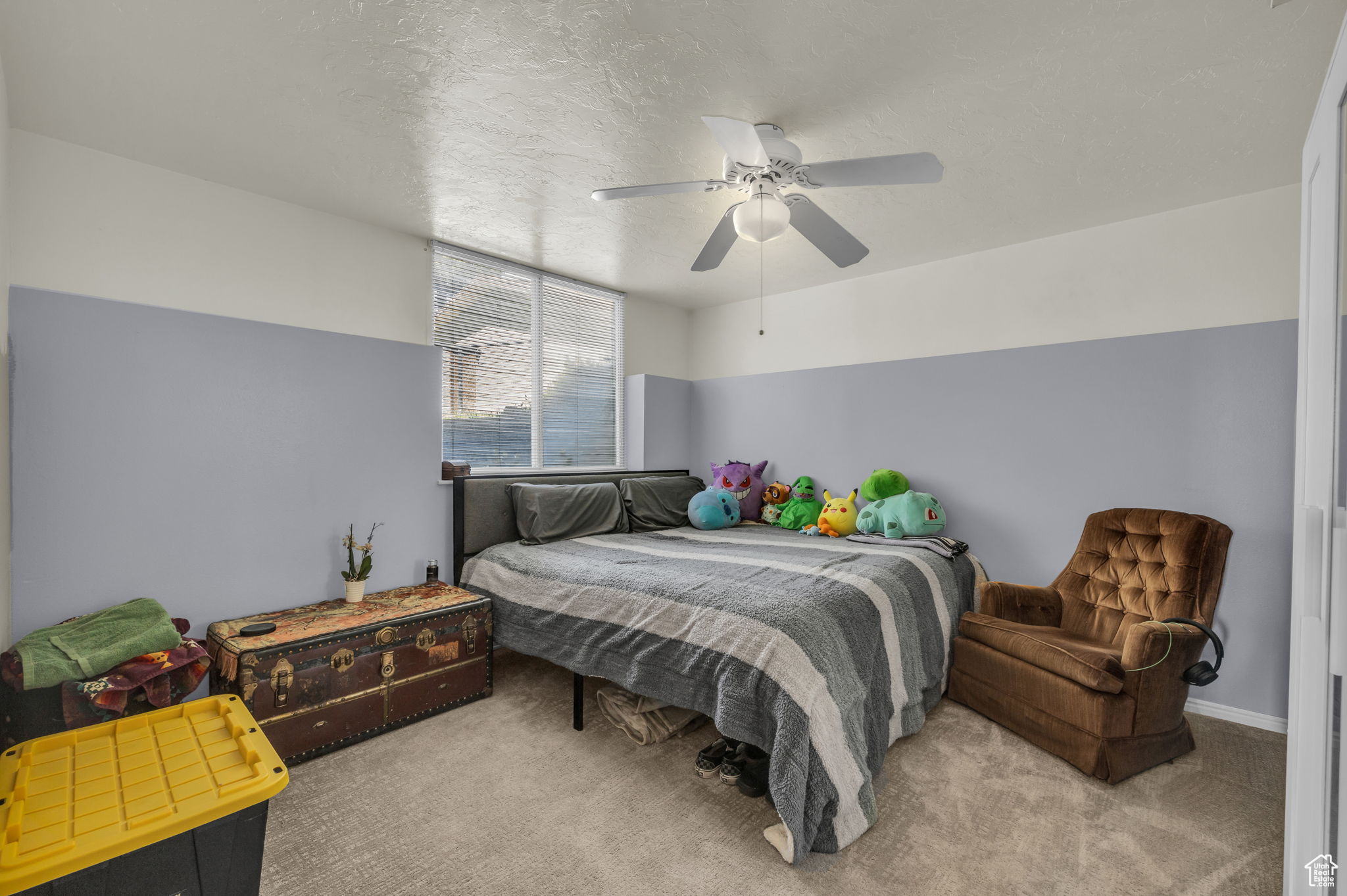 Bedroom with ceiling fan and carpet