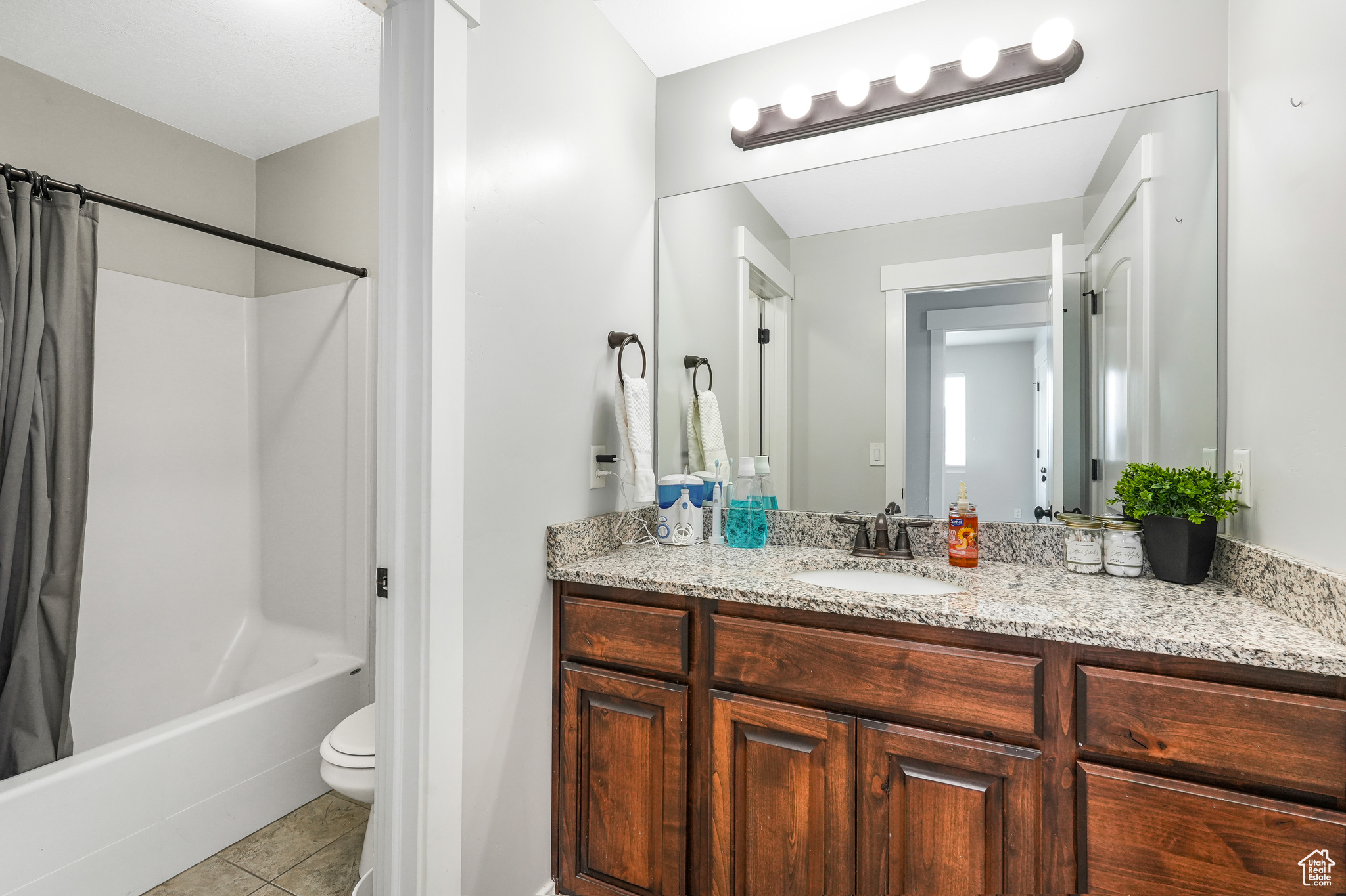 Hall bath on 2nd story with separate tub/shower combo from the comfort height vanity and linen closet.
