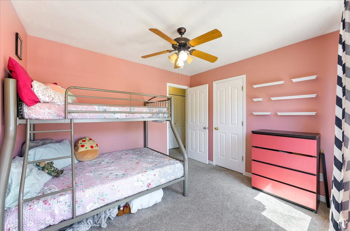 Unfurnished bedroom with carpet floors and ceiling fan