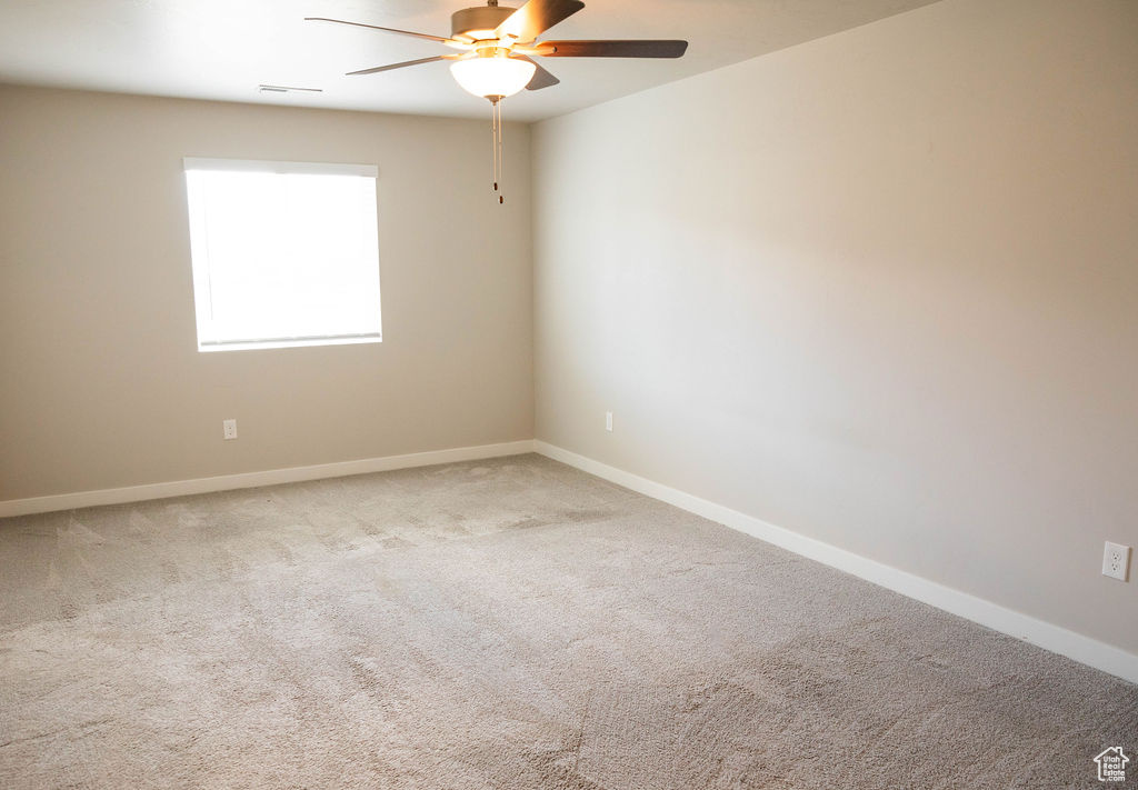 Master bedroom with ceiling fan and carpet flooring