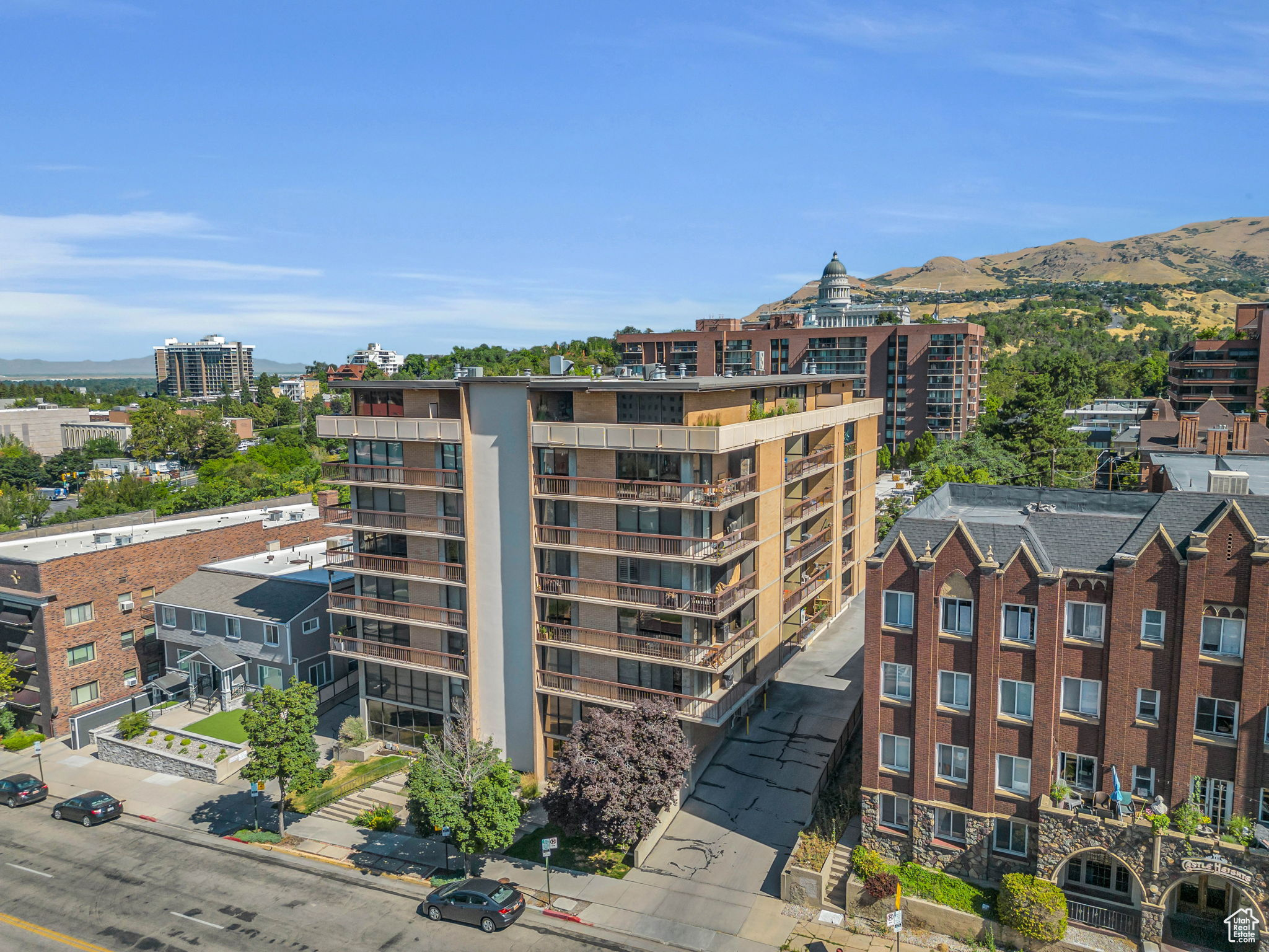 View of City Crest Condominiums exterior featuring the state capitol in the background