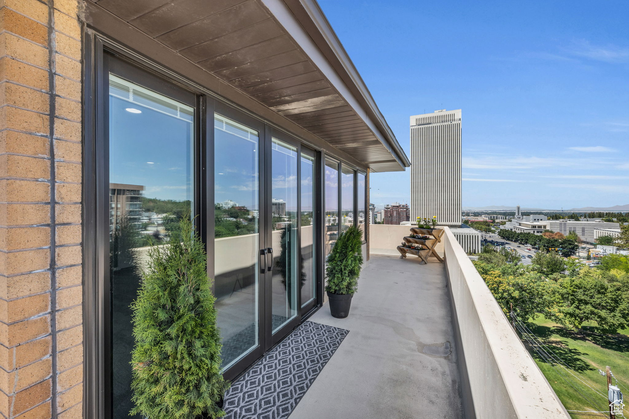 View to west and north and east from 700 sq ft wrap around open-air private balcony