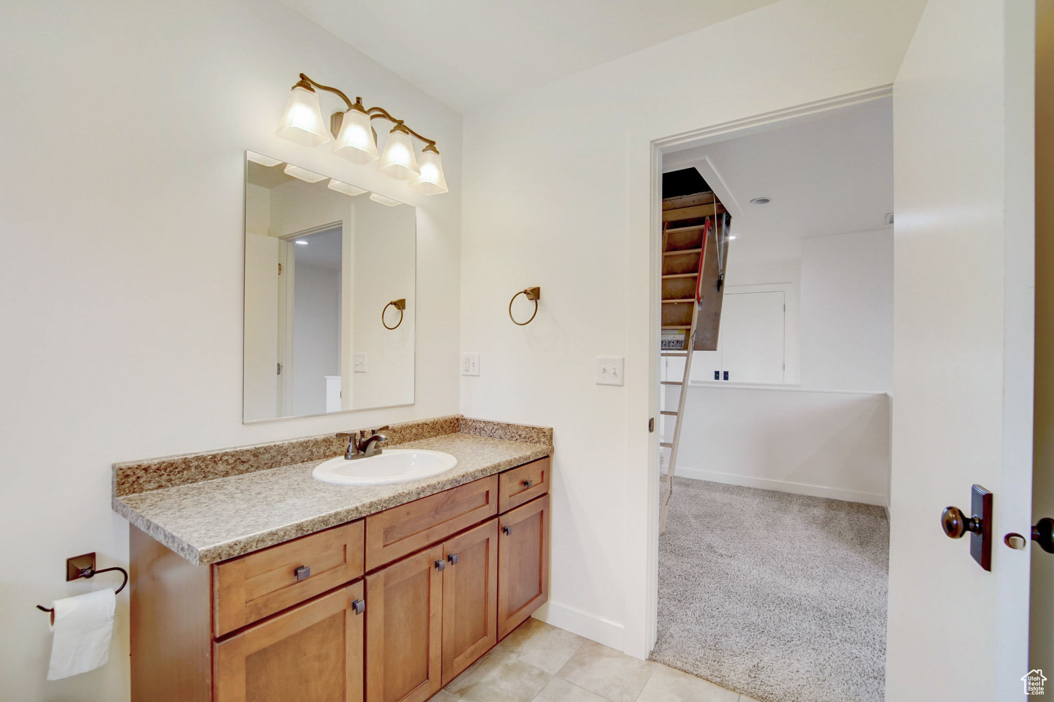 Bathroom featuring oversized vanity and tile flooring