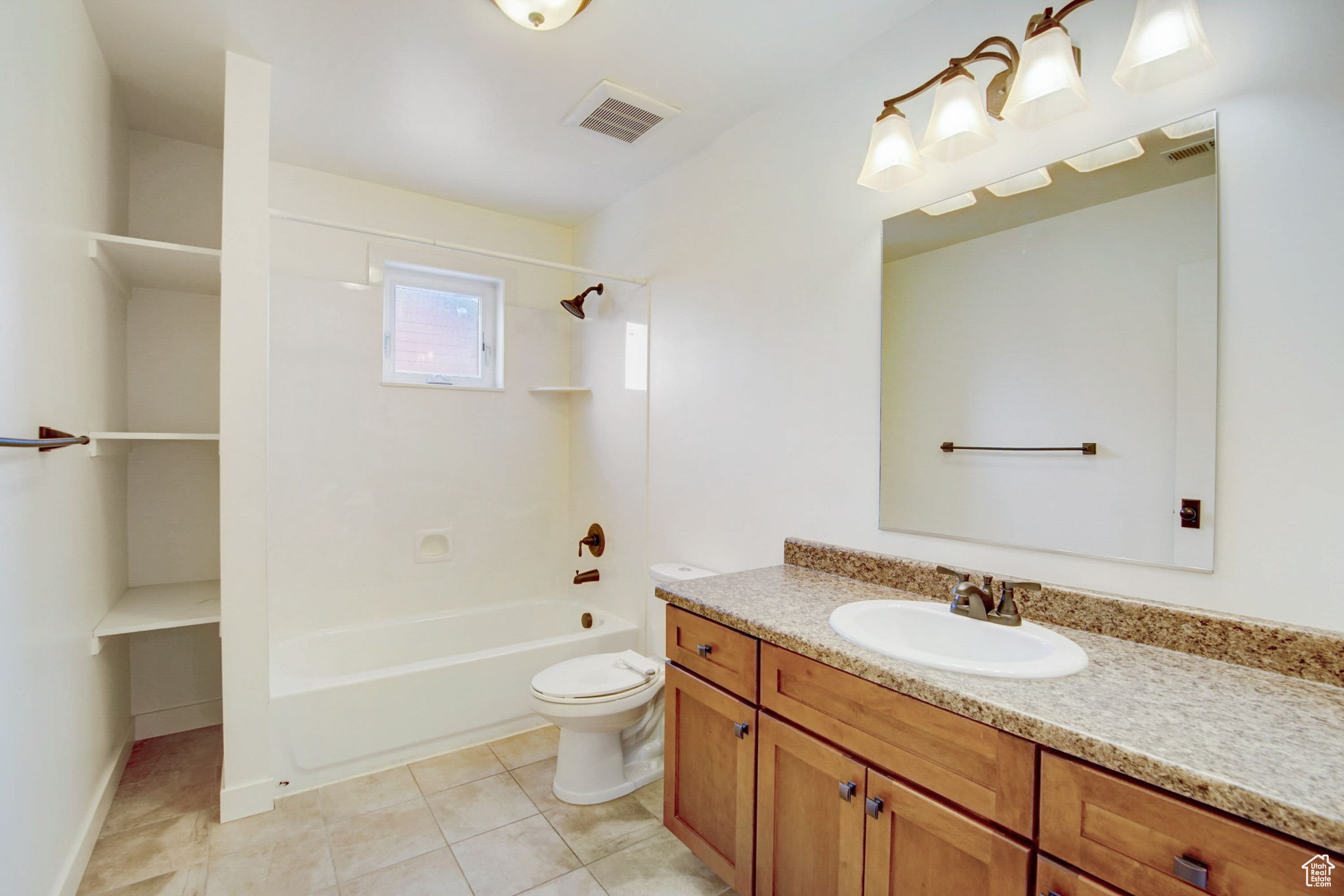 Full bathroom featuring tile flooring, toilet, shower / bathing tub combination, and large vanity
