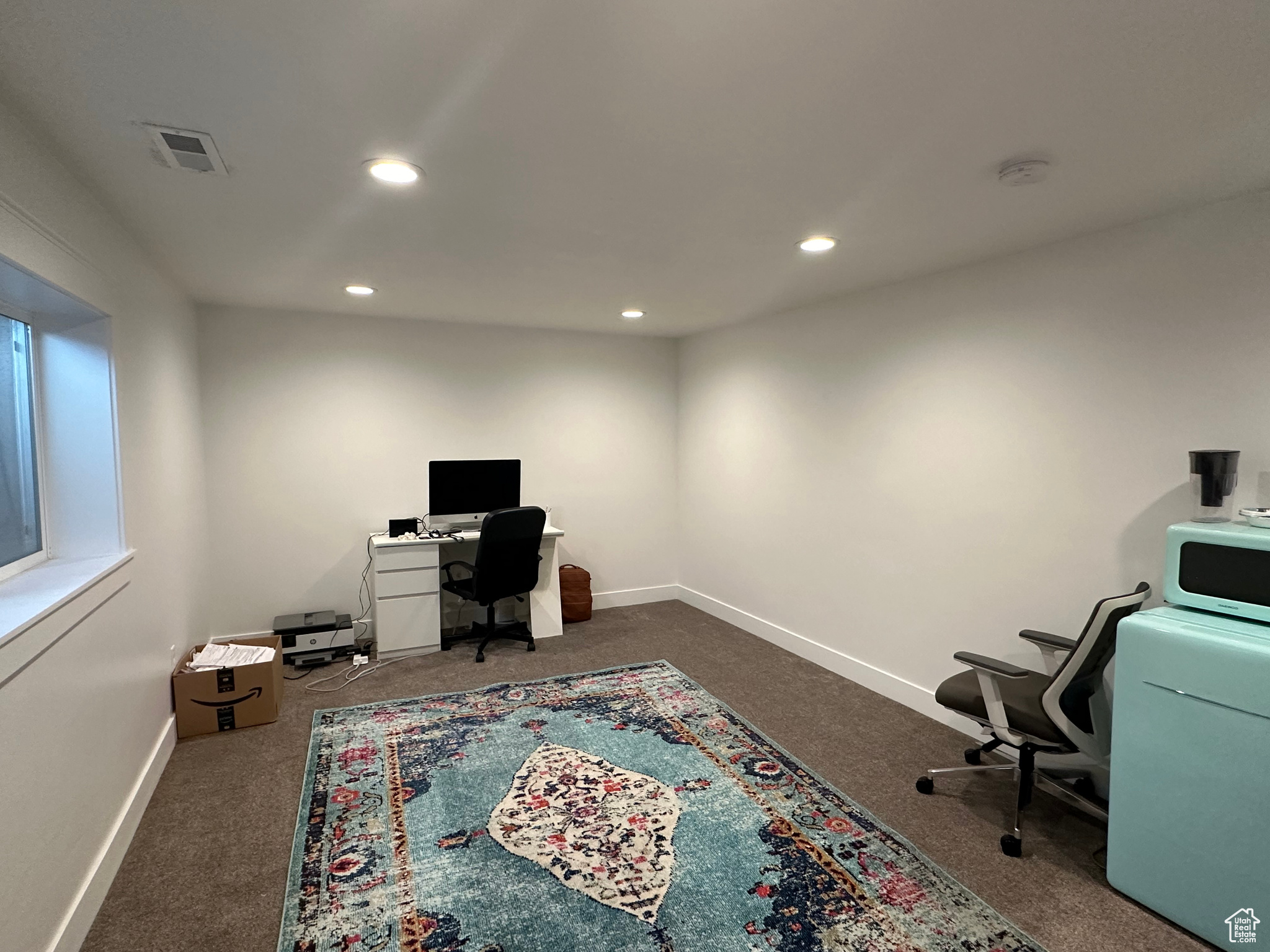 Office with dark carpet