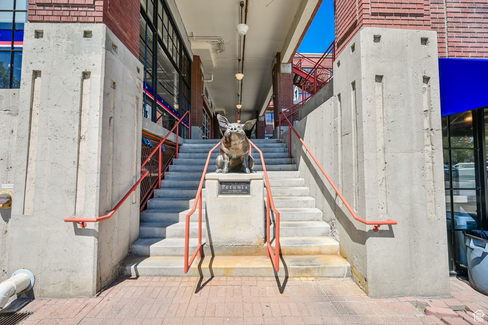 Stairs with rail lighting and a towering ceiling