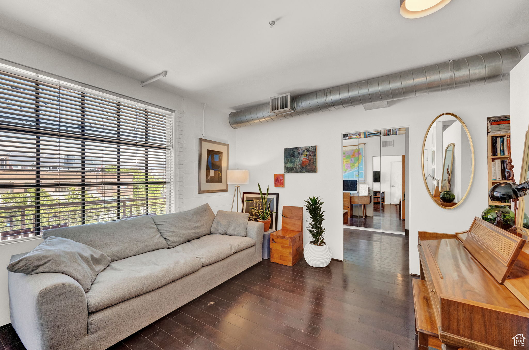 Living room with dark hardwood / wood-style flooring