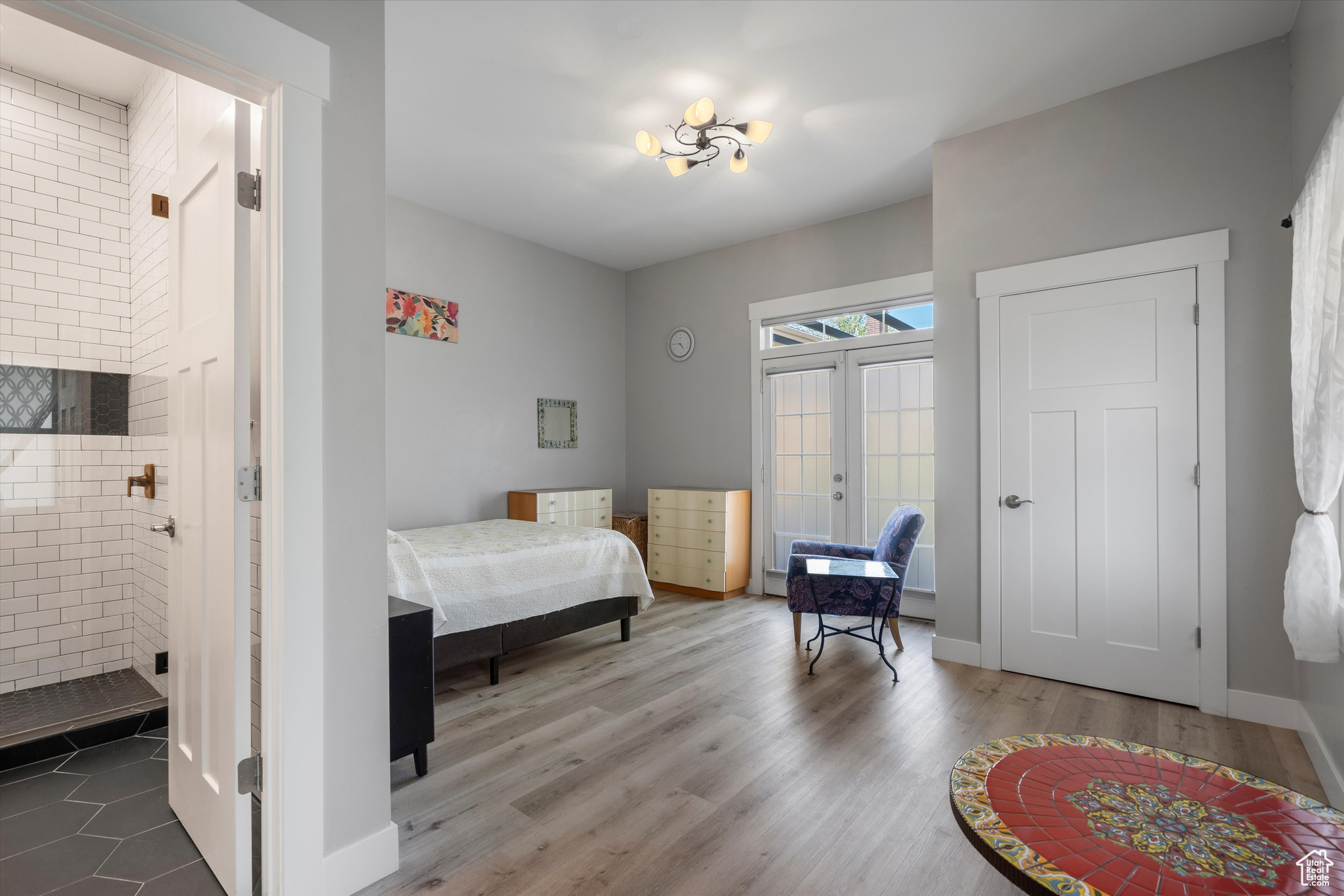 Bedroom featuring w/ french doors to outdoor patio