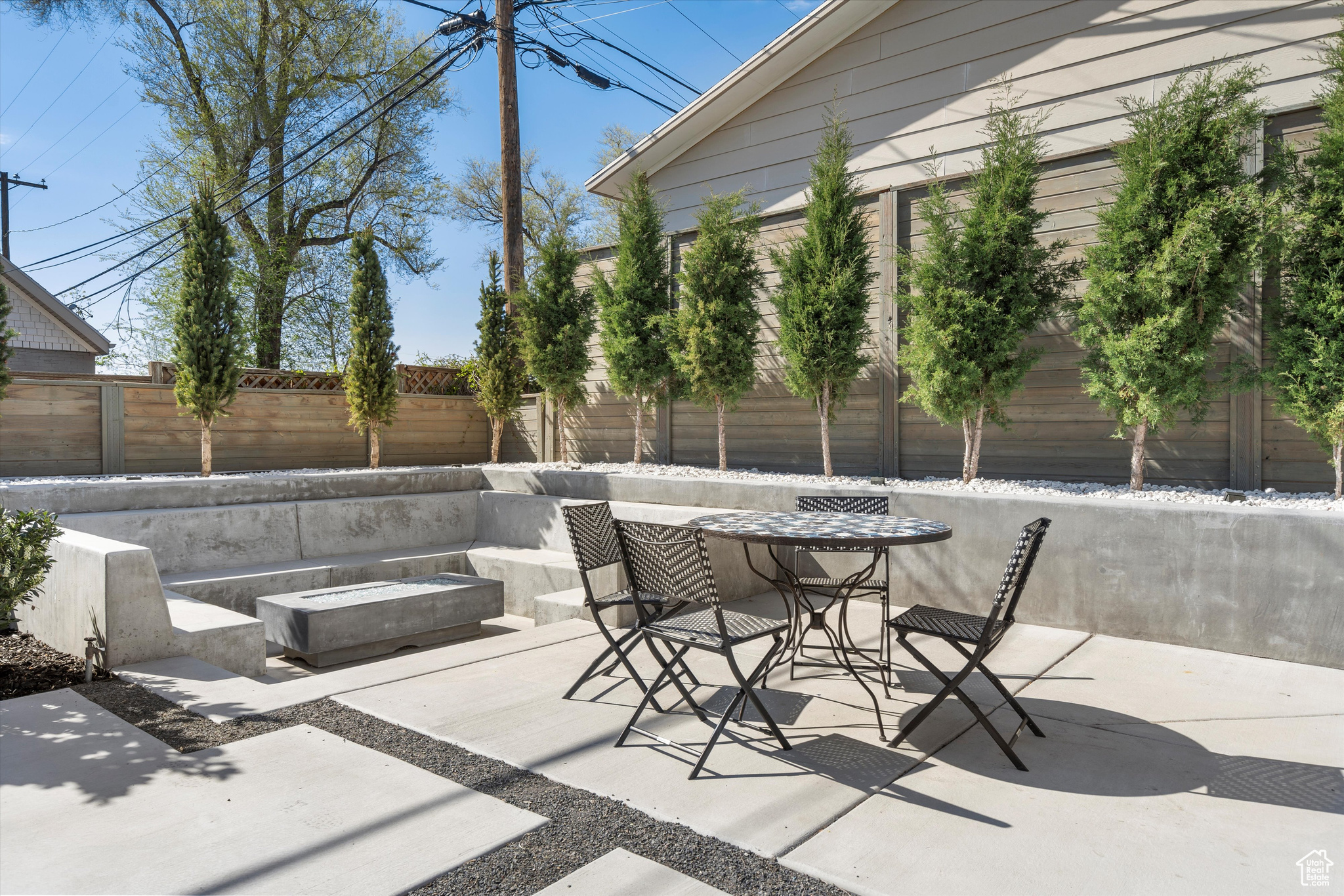 View of patio featuring a fire pit