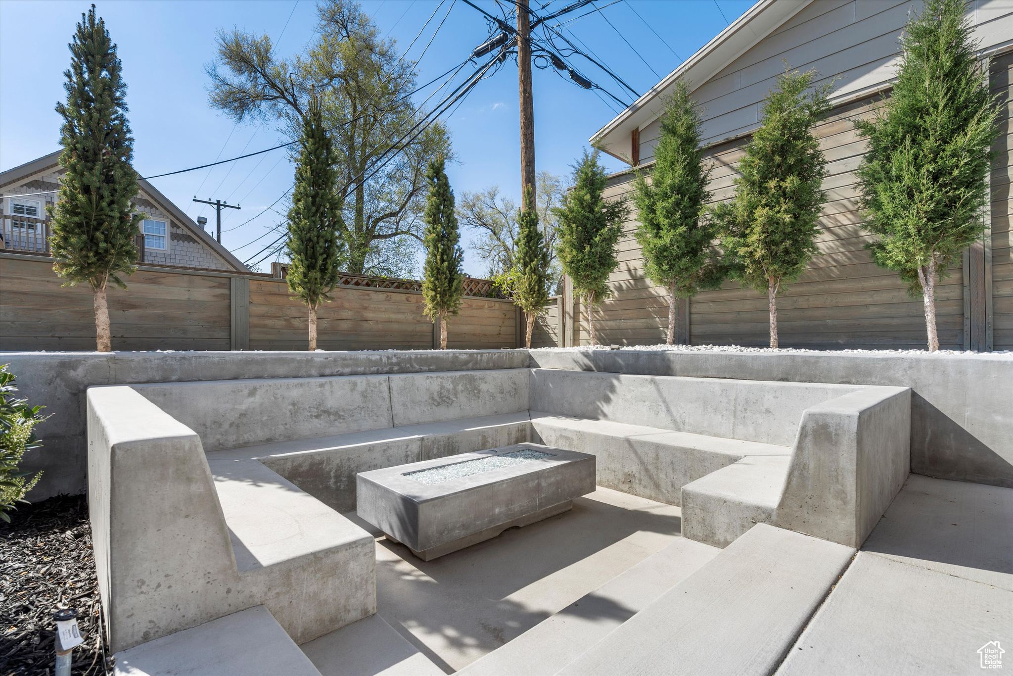 View of patio featuring an outdoor fire pit