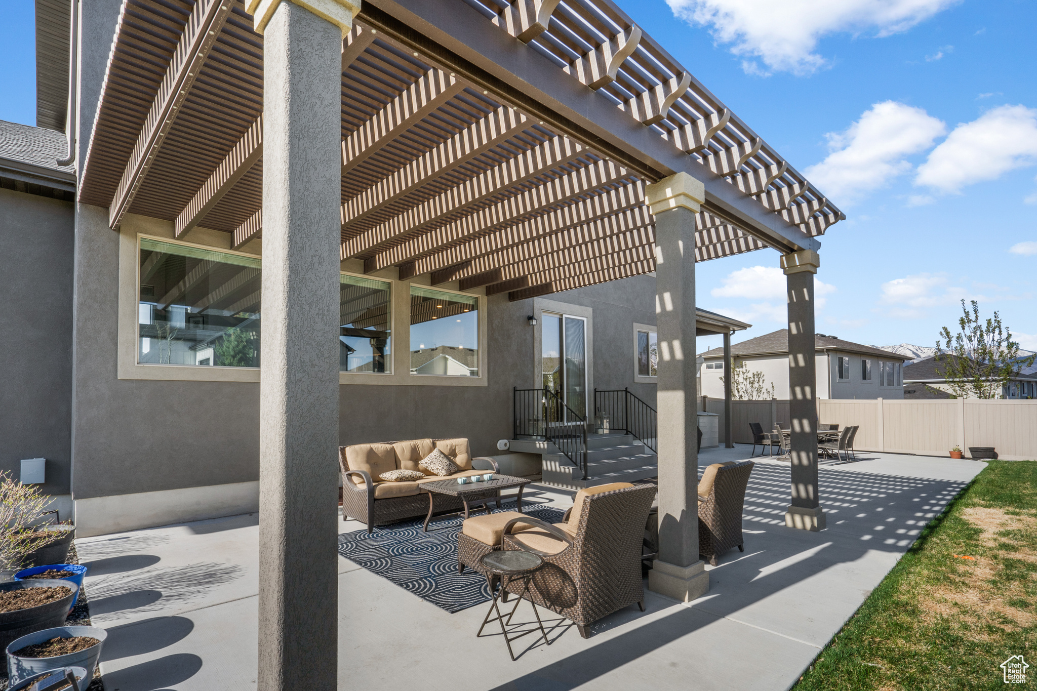 View of patio with an outdoor living space and a pergola