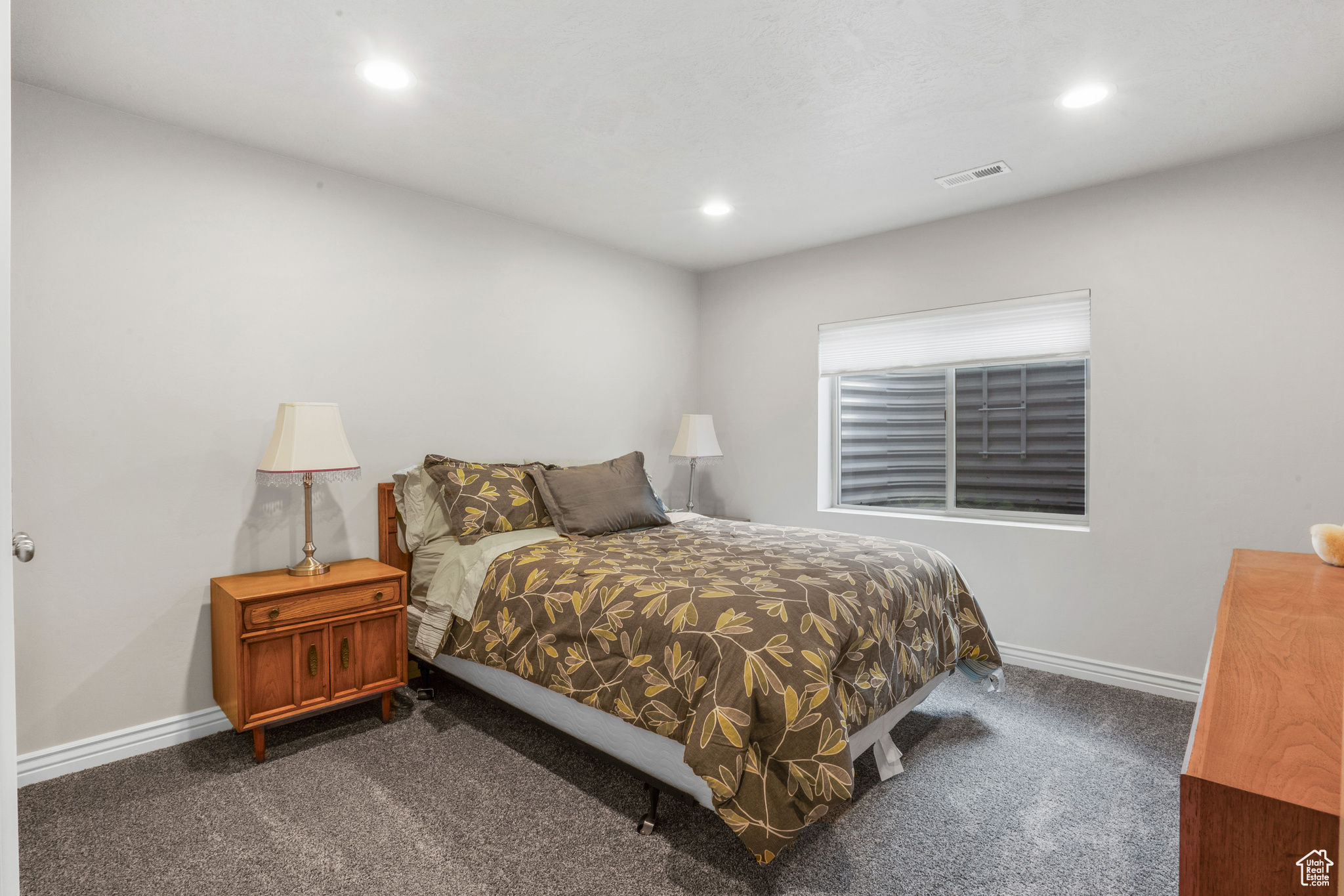 Bedroom with dark carpet