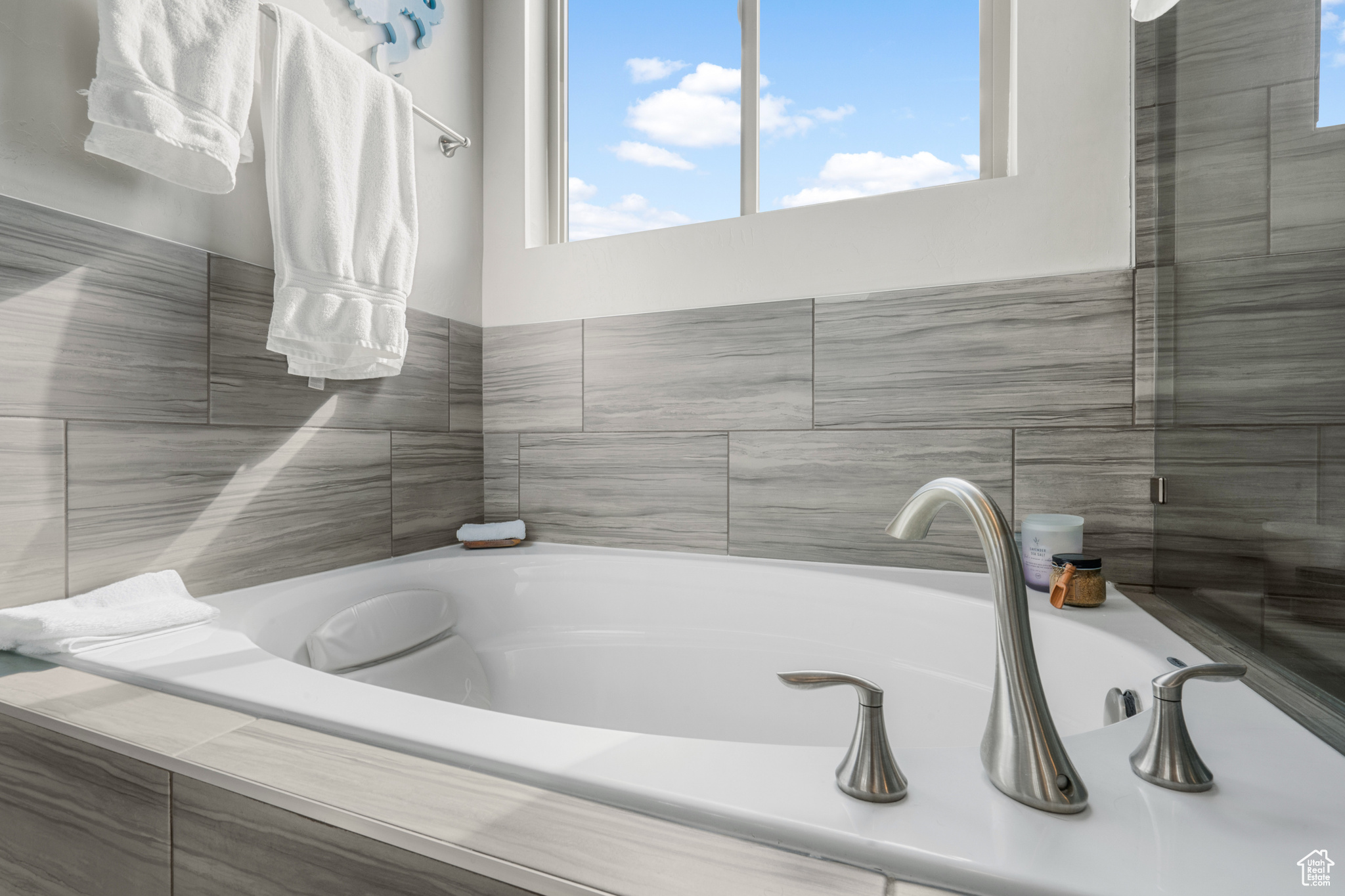 Bathroom featuring tiled bath