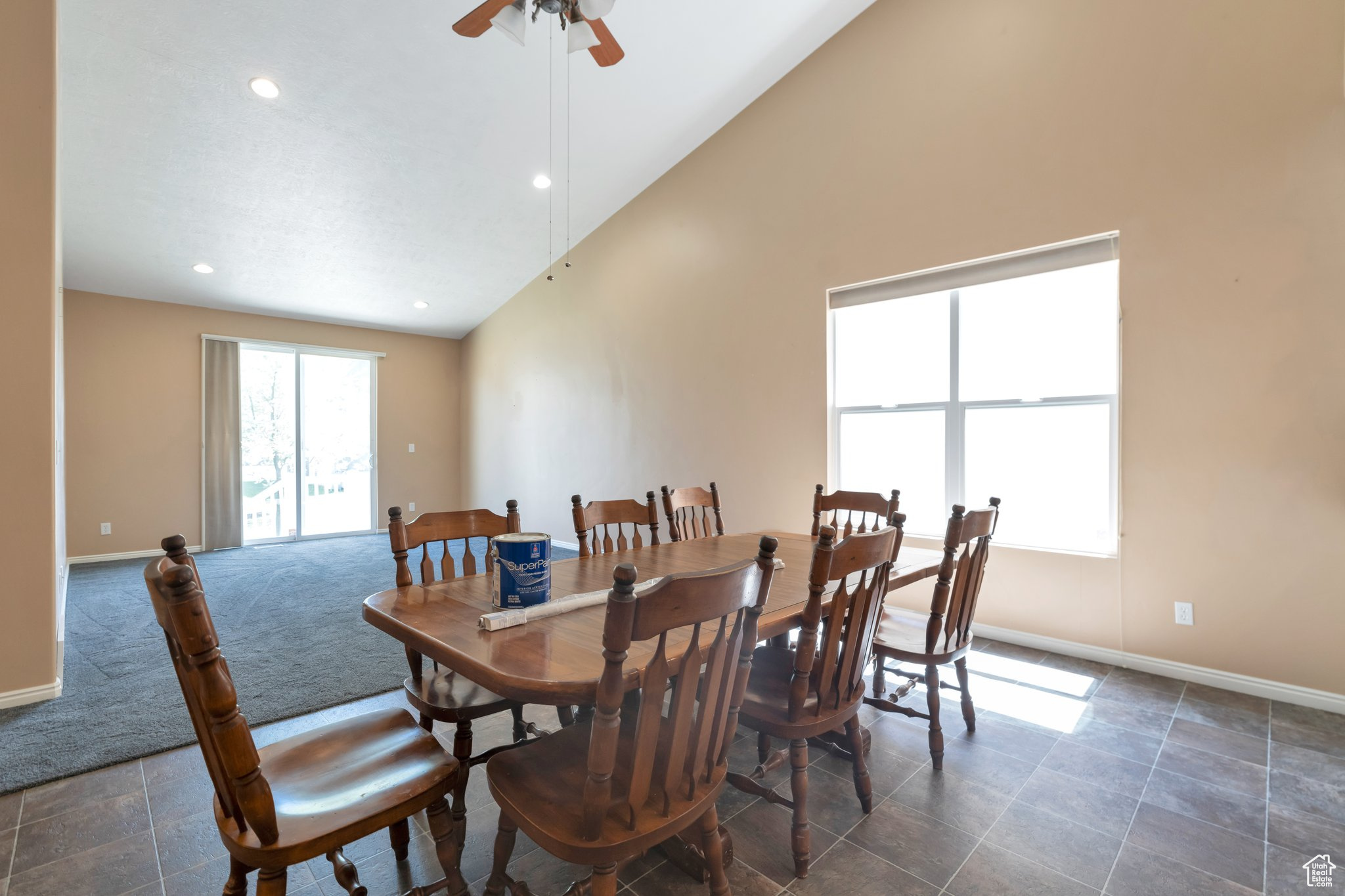 Dining area with high vaulted ceiling and great room