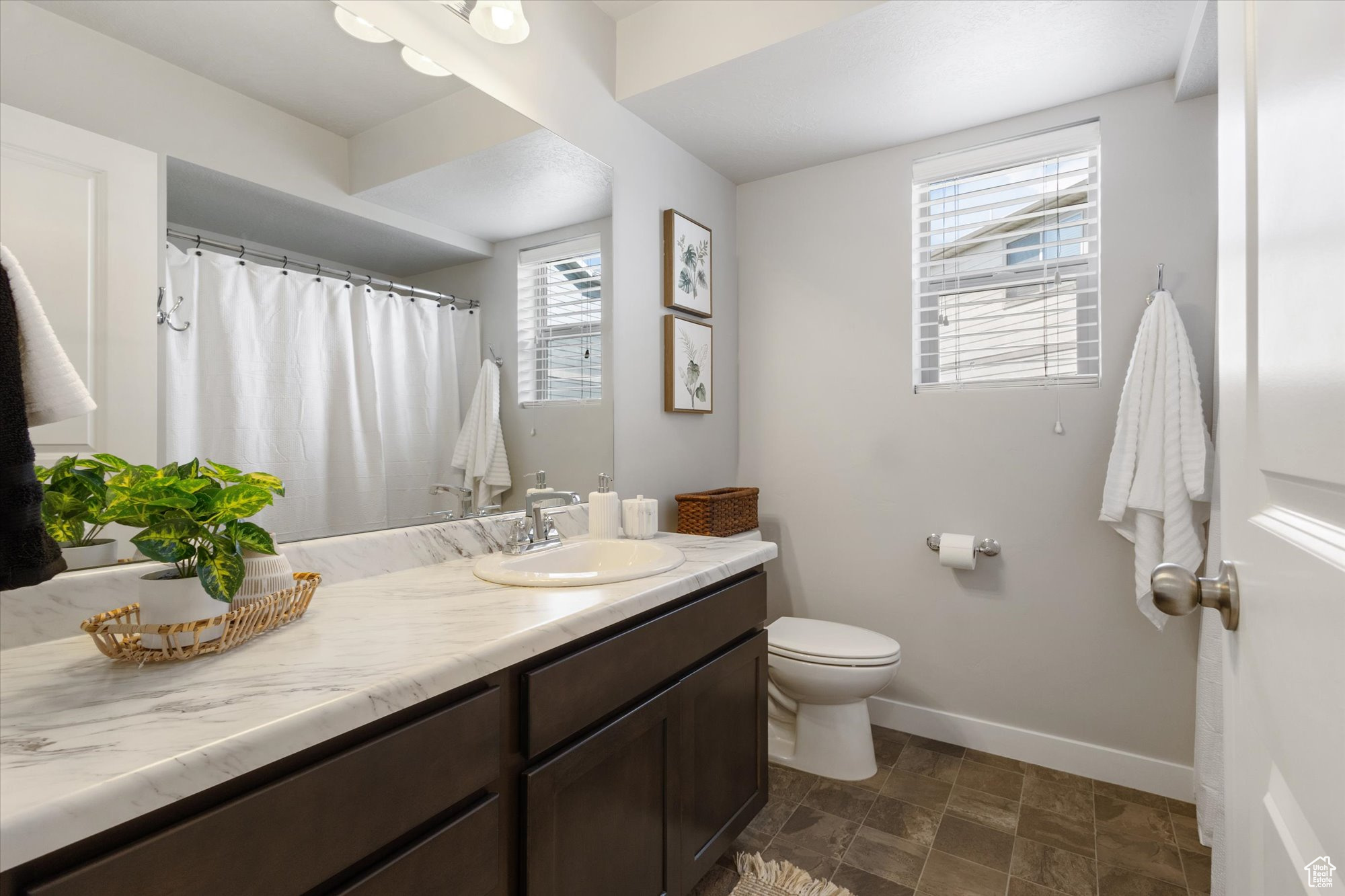 Full Bathroom with a wealth of natural light and large vanity