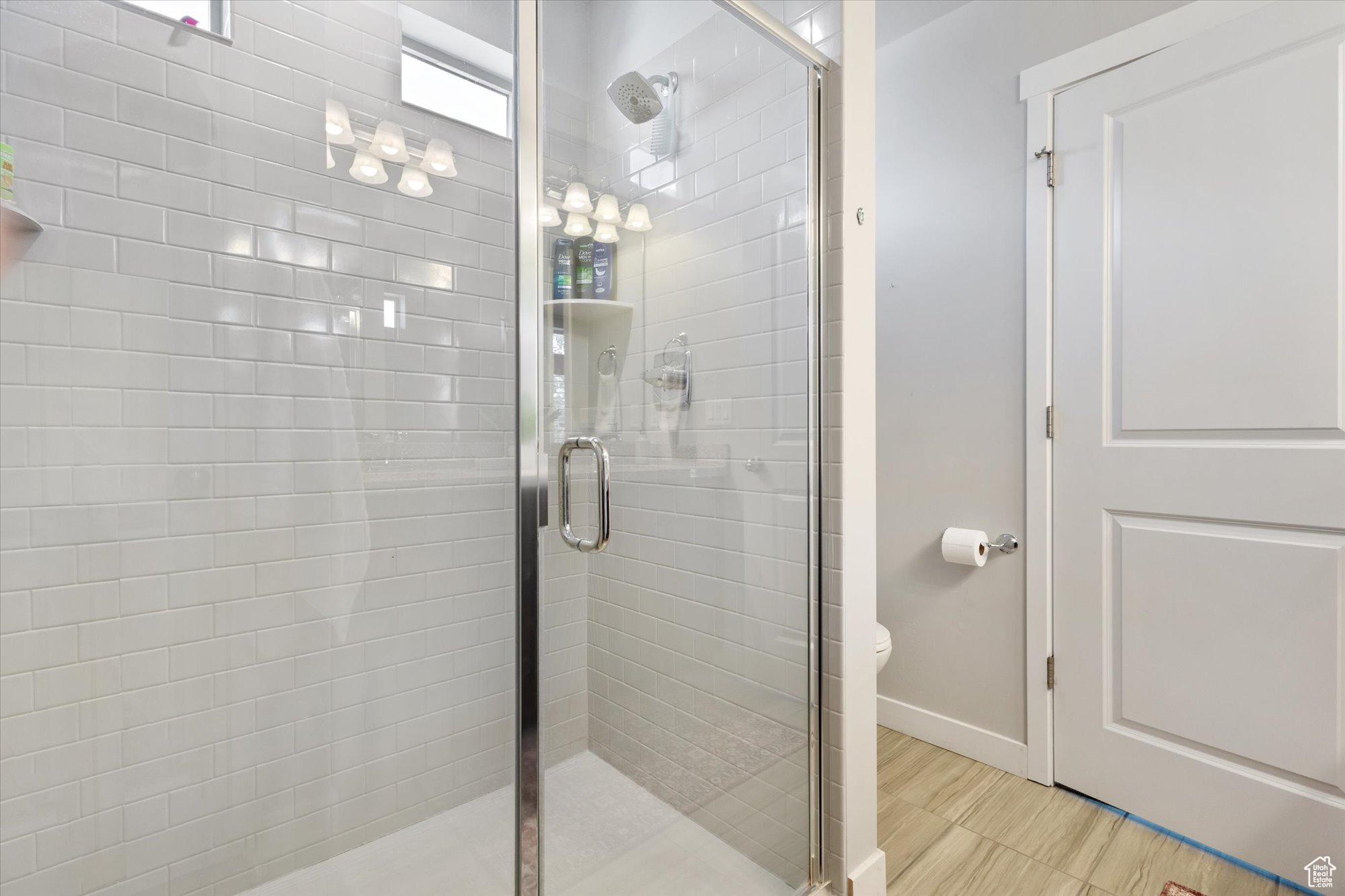 Master Bathroom with an enclosed shower and tile floors