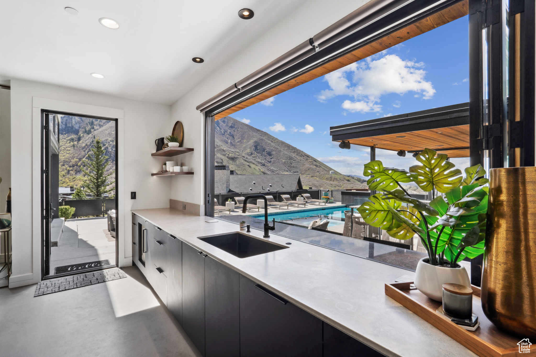 Kitchen Window Completely Opens To Outdoor Entertainment Pool Area