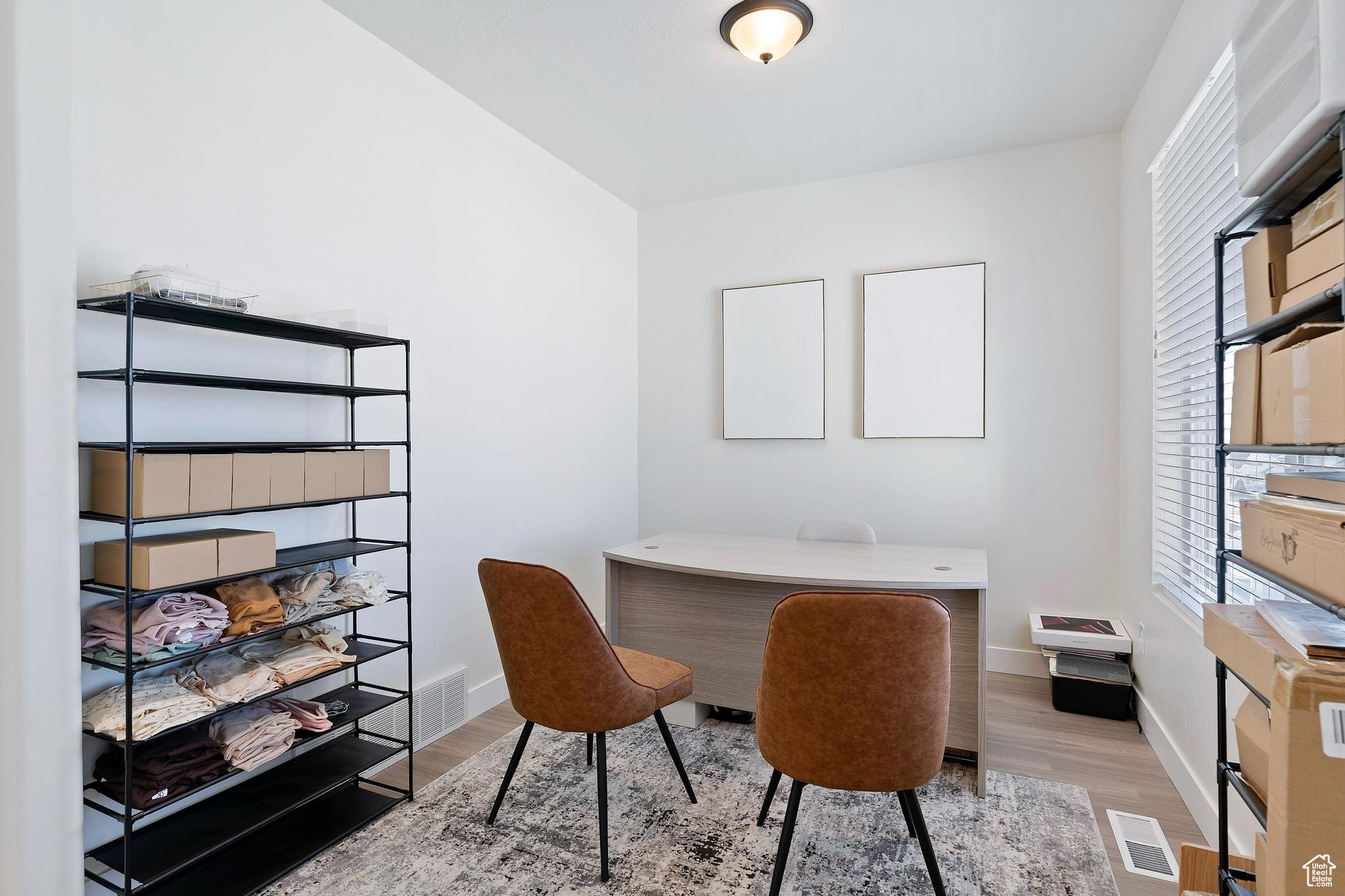 Office area featuring light wood-type flooring