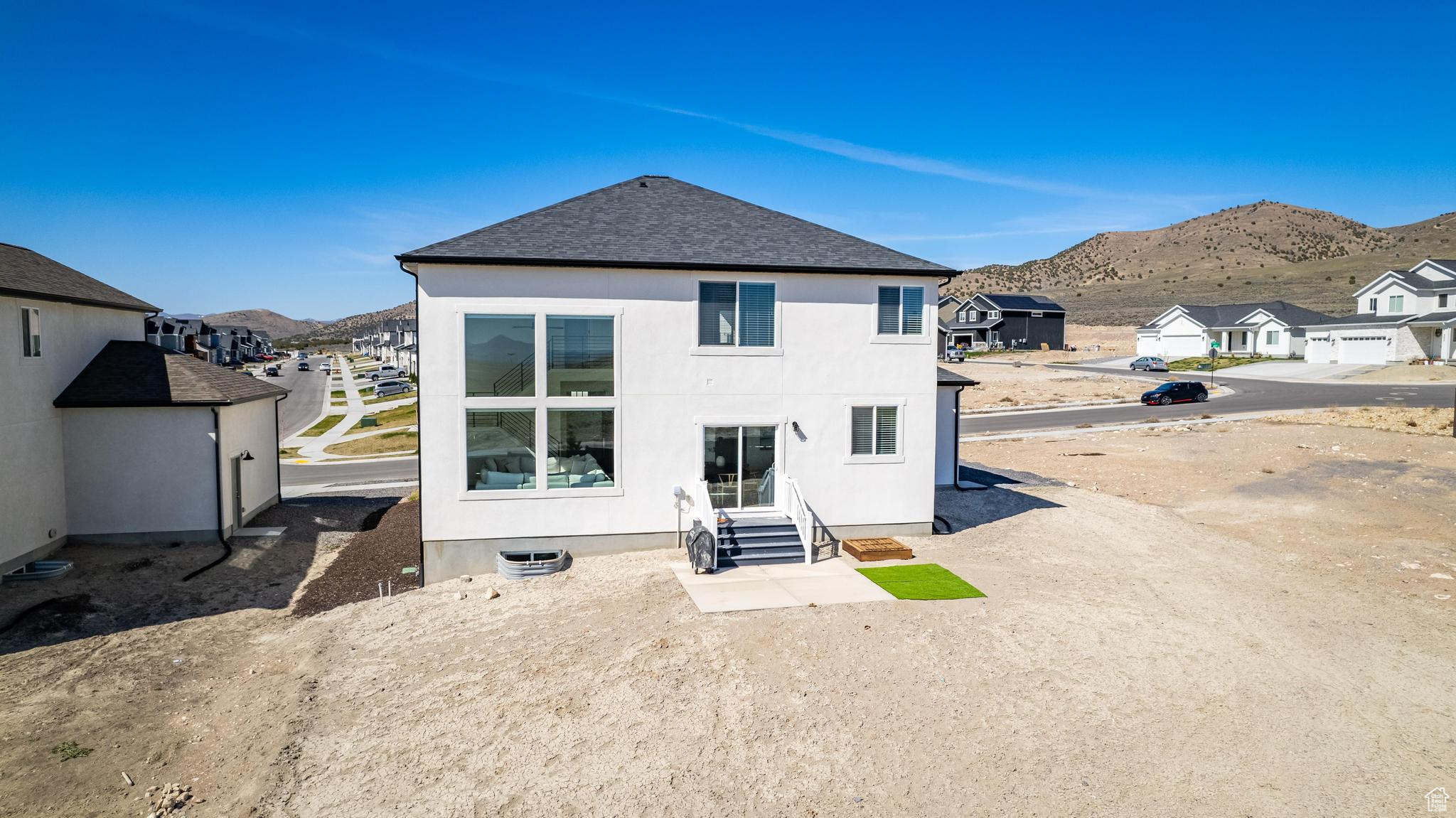 Back of property featuring a mountain view