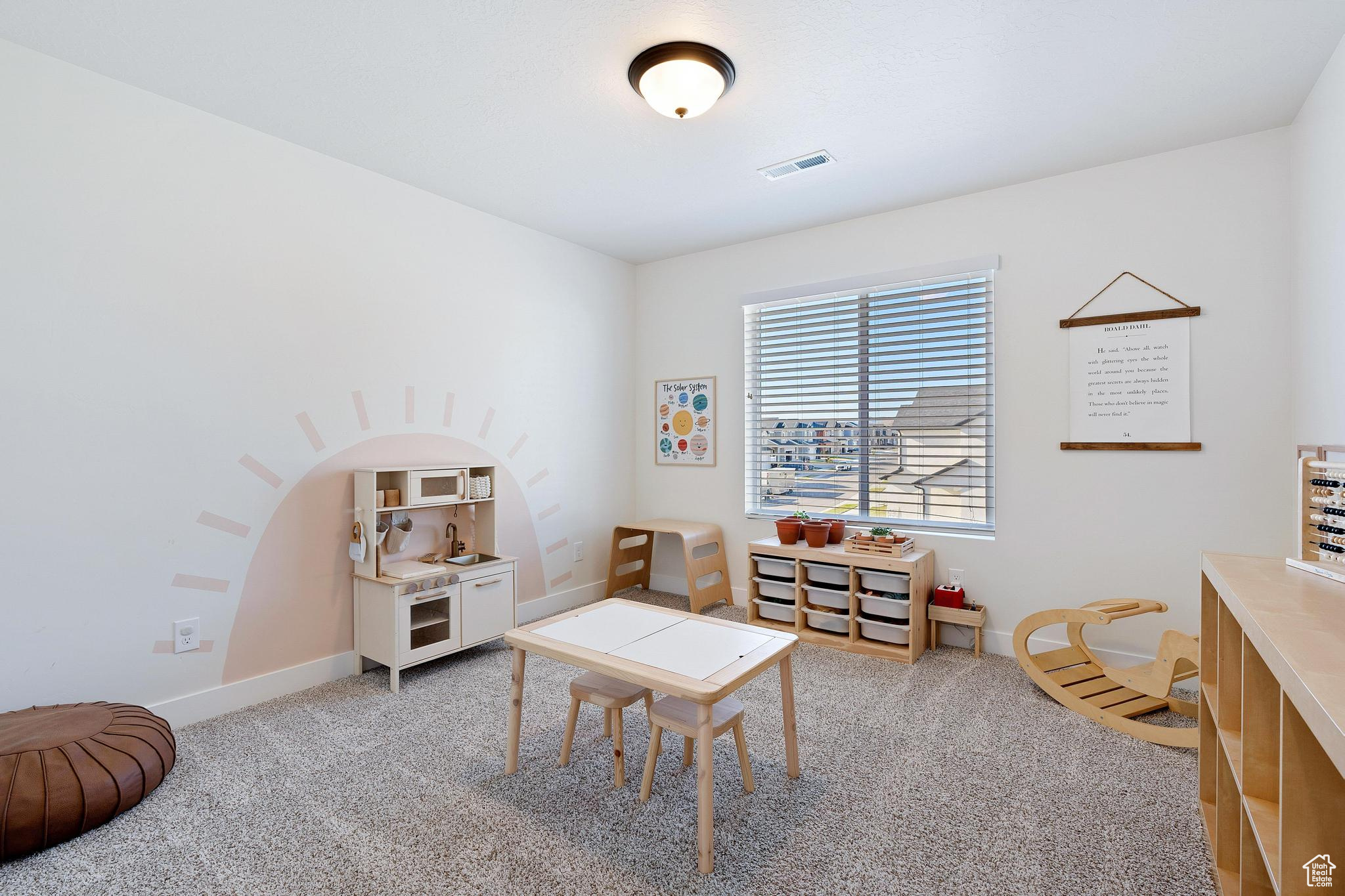 Game room with carpet flooring