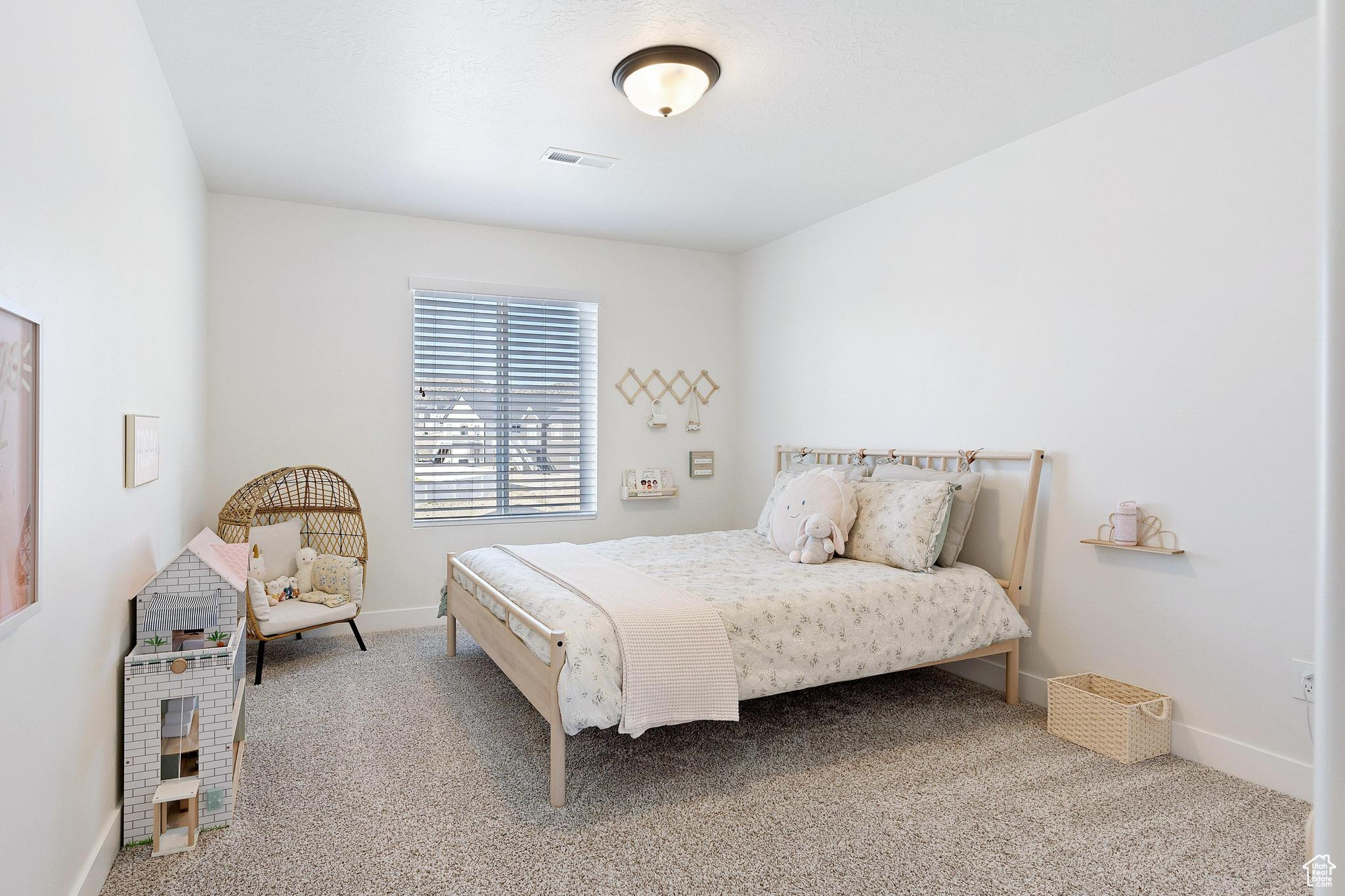 Bedroom with carpet flooring