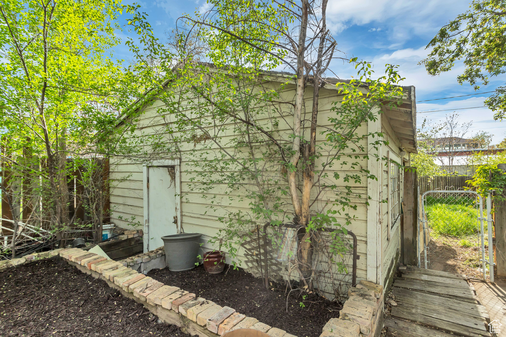 Detached garage at the back edge of the property, with private lane for plenty of parking