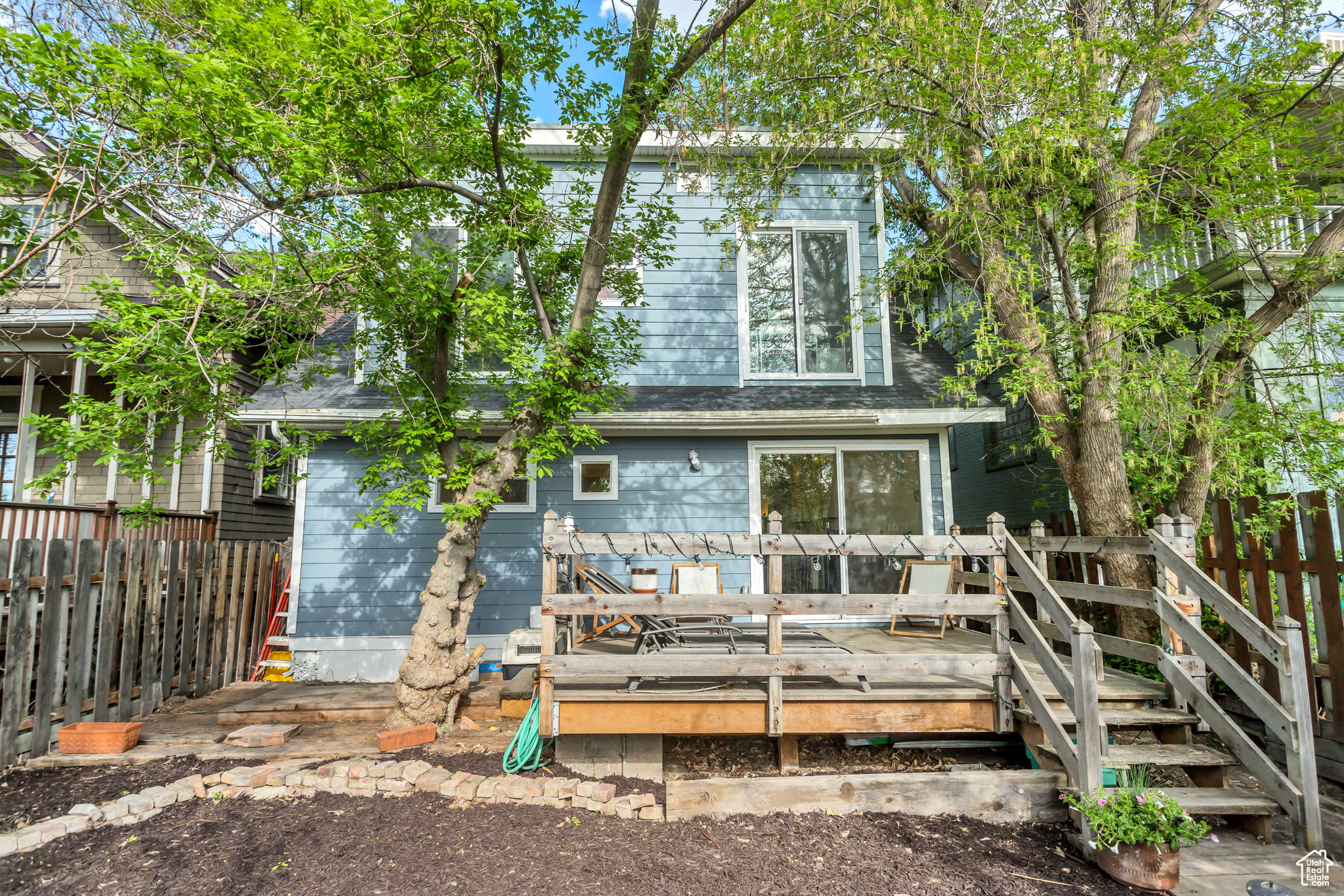 View of the back of the home and deck