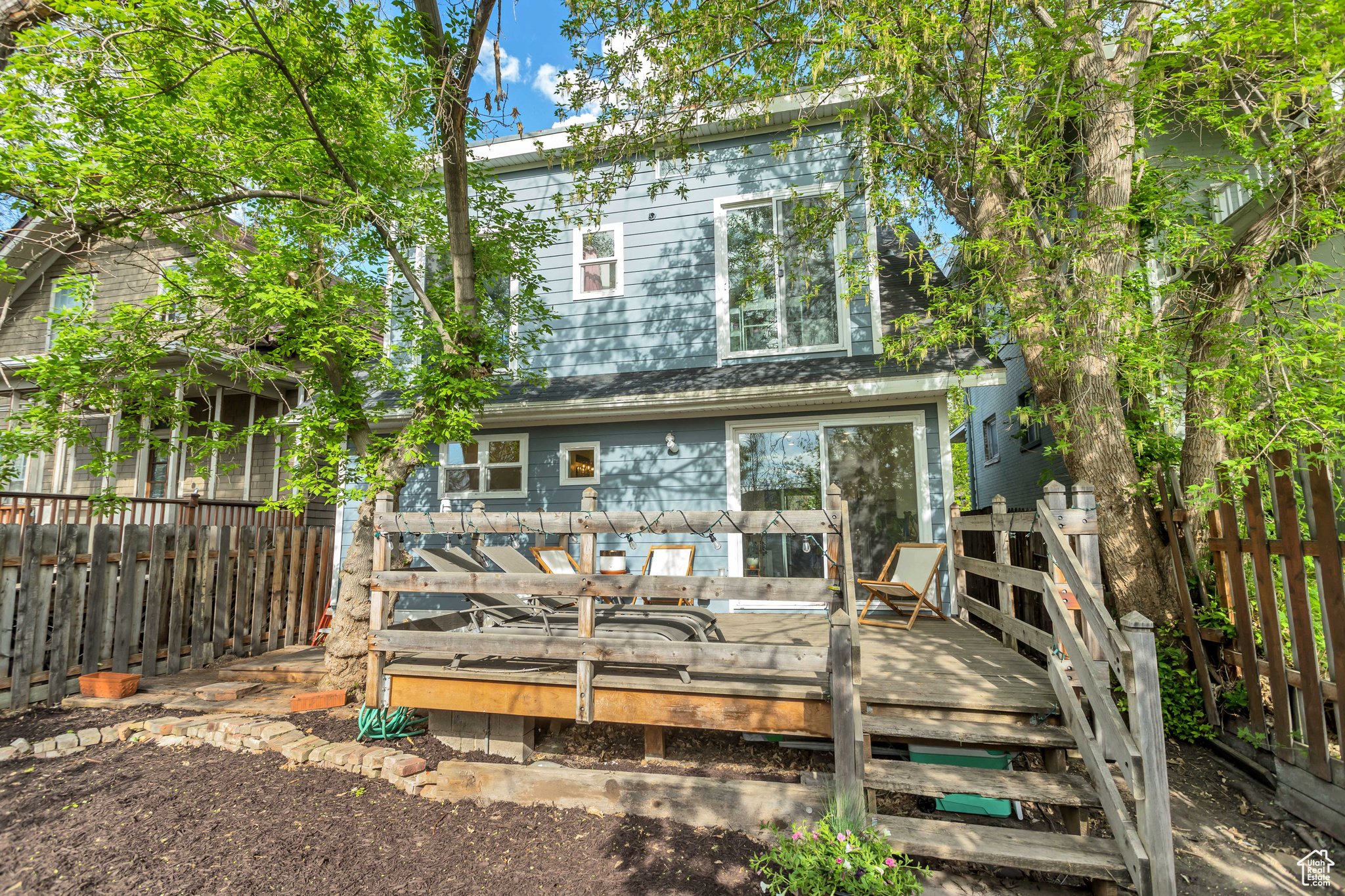 Back of house featuring a spacious deck for entertaining