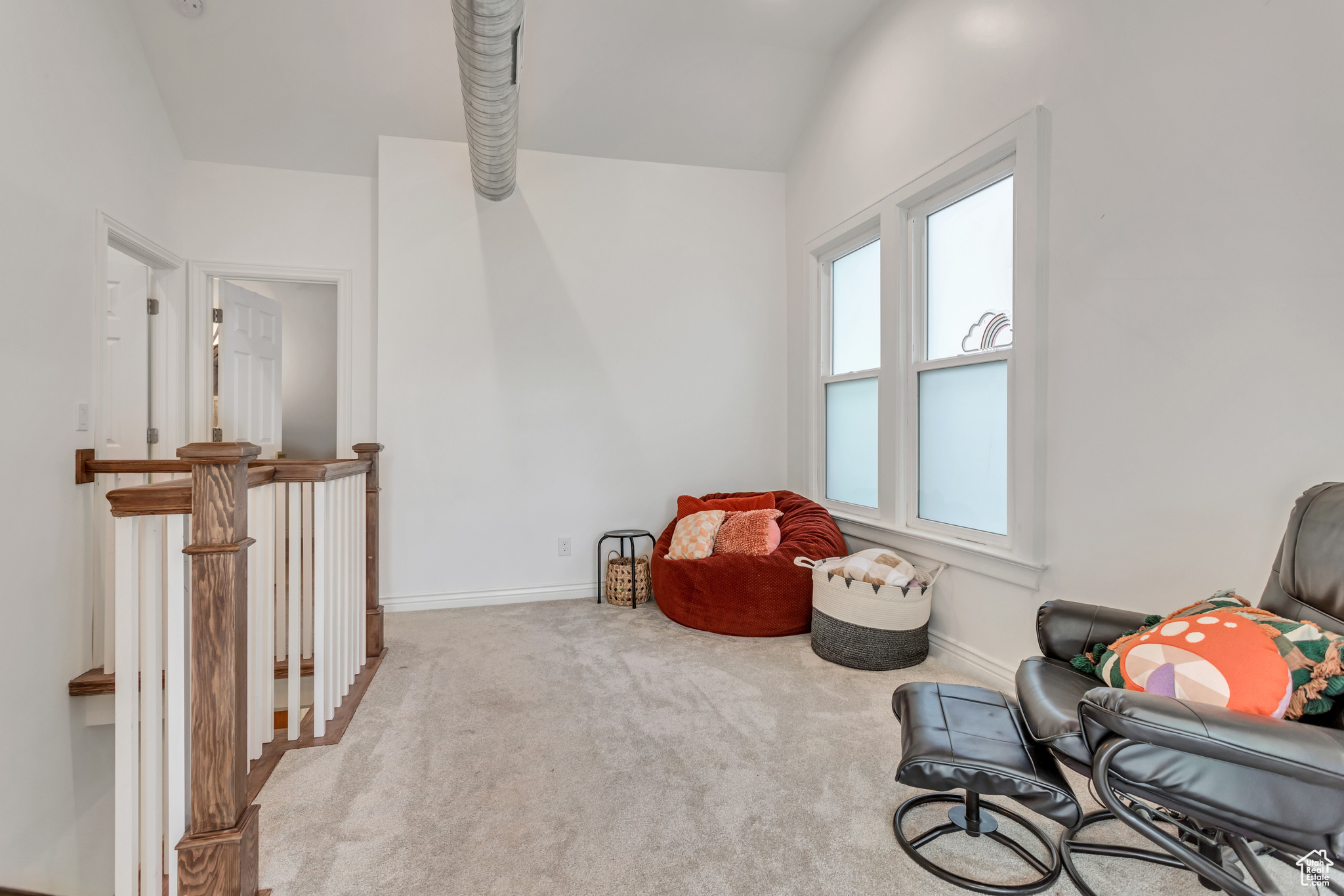 The second floor loft features soaring vaulted ceilings, a beautiful craftsman railing and plenty of flex room to suit your needs