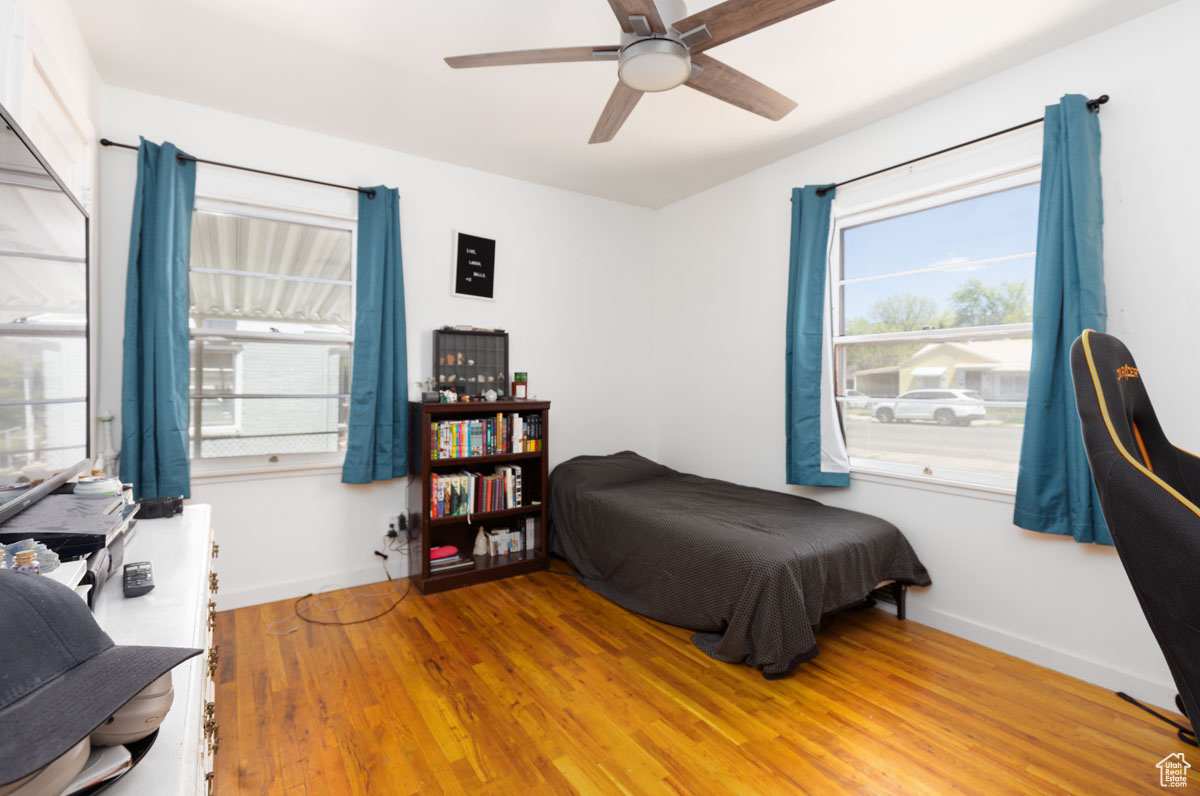 Bedroom with wood-type flooring and ceiling fan