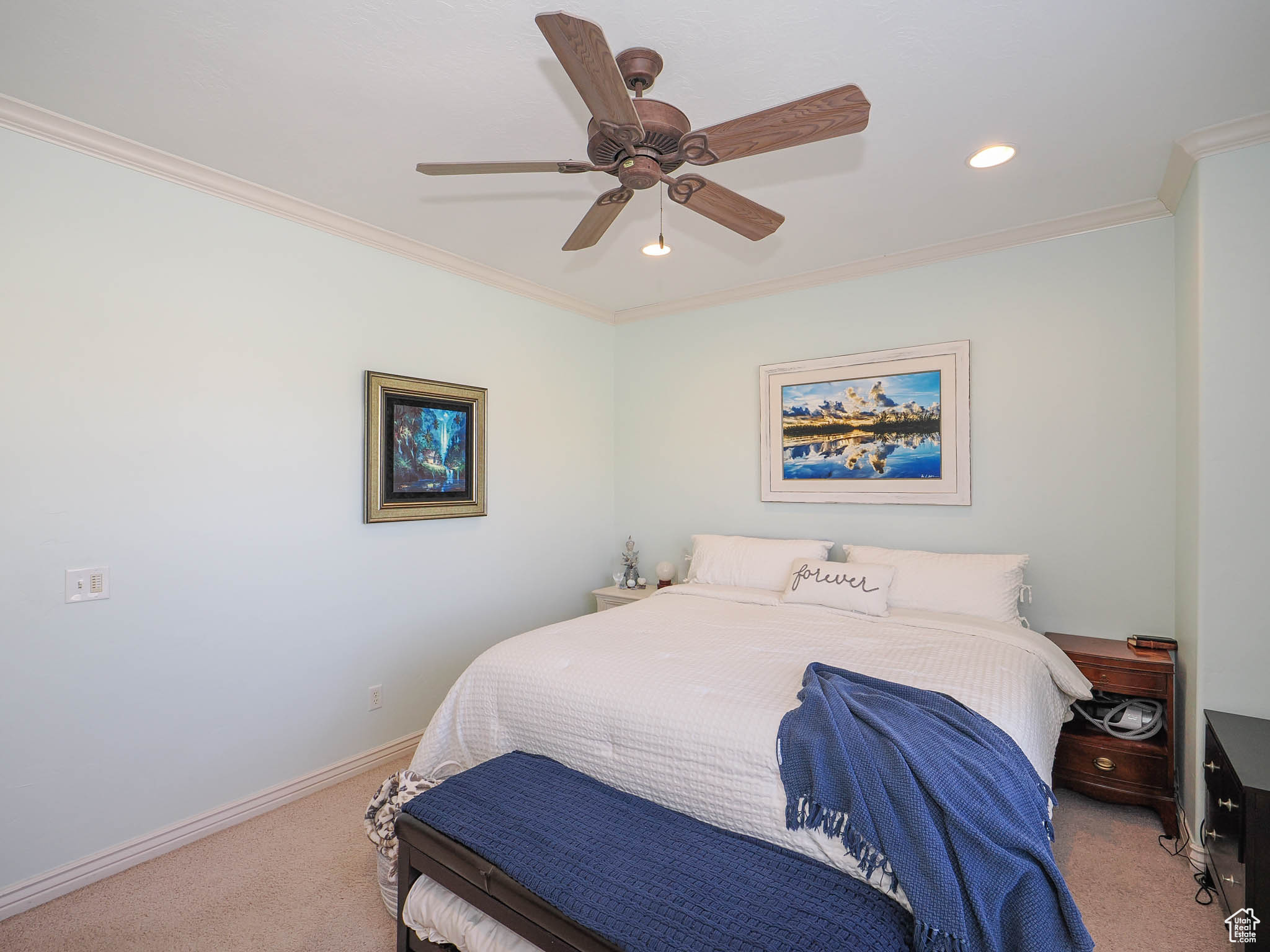 Master bedroom with crown molding and ceiling fan
