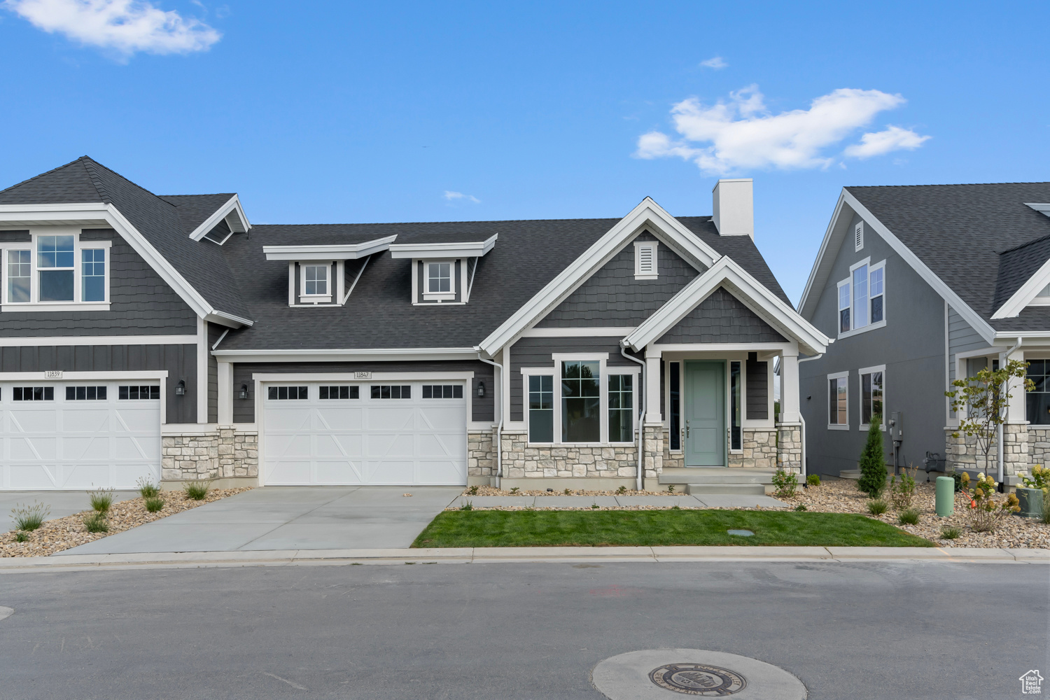 Craftsman inspired home featuring a garage and a porch