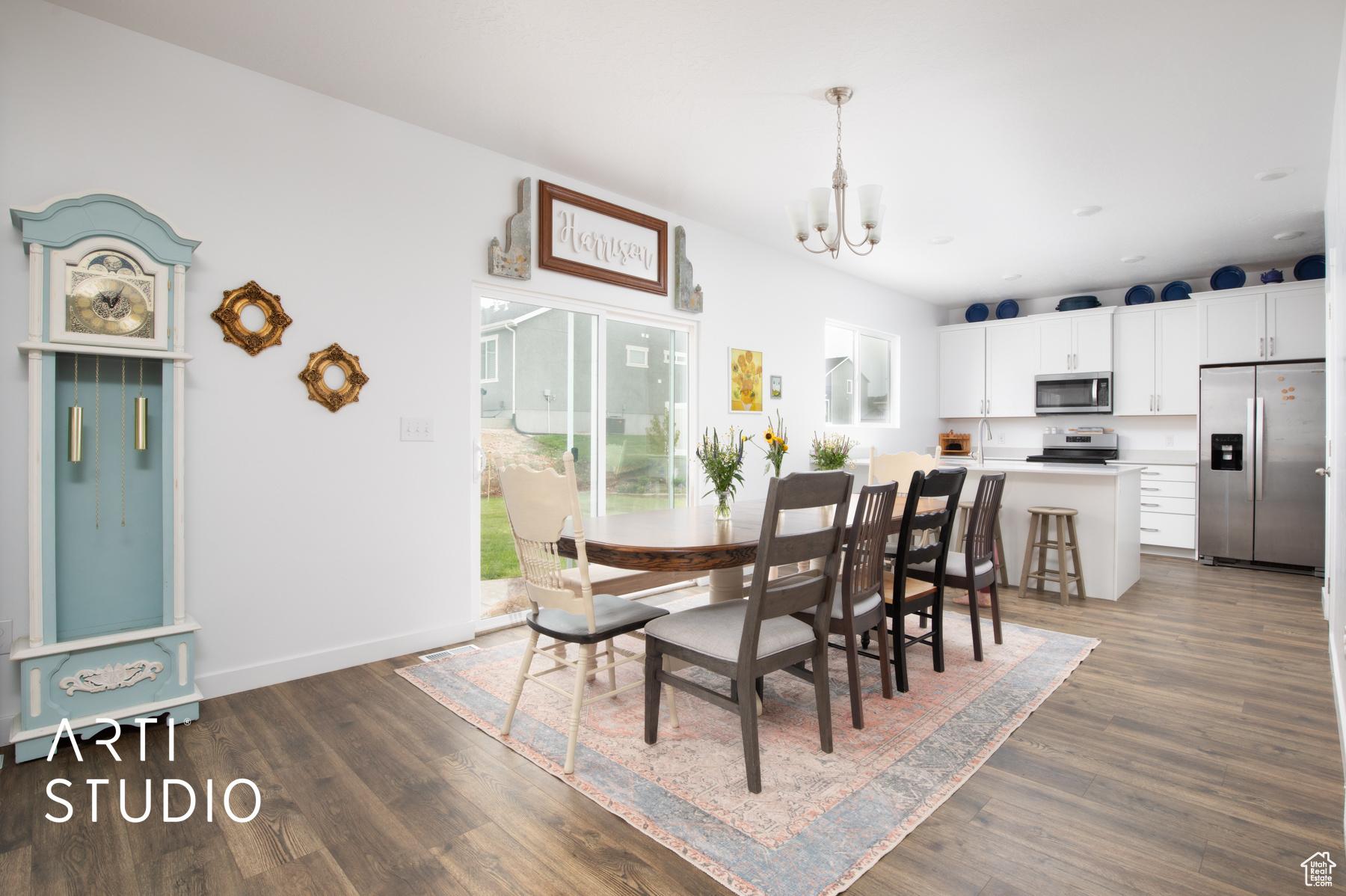 Dining space featuring a chandelier and dark hardwood / wood-style floors